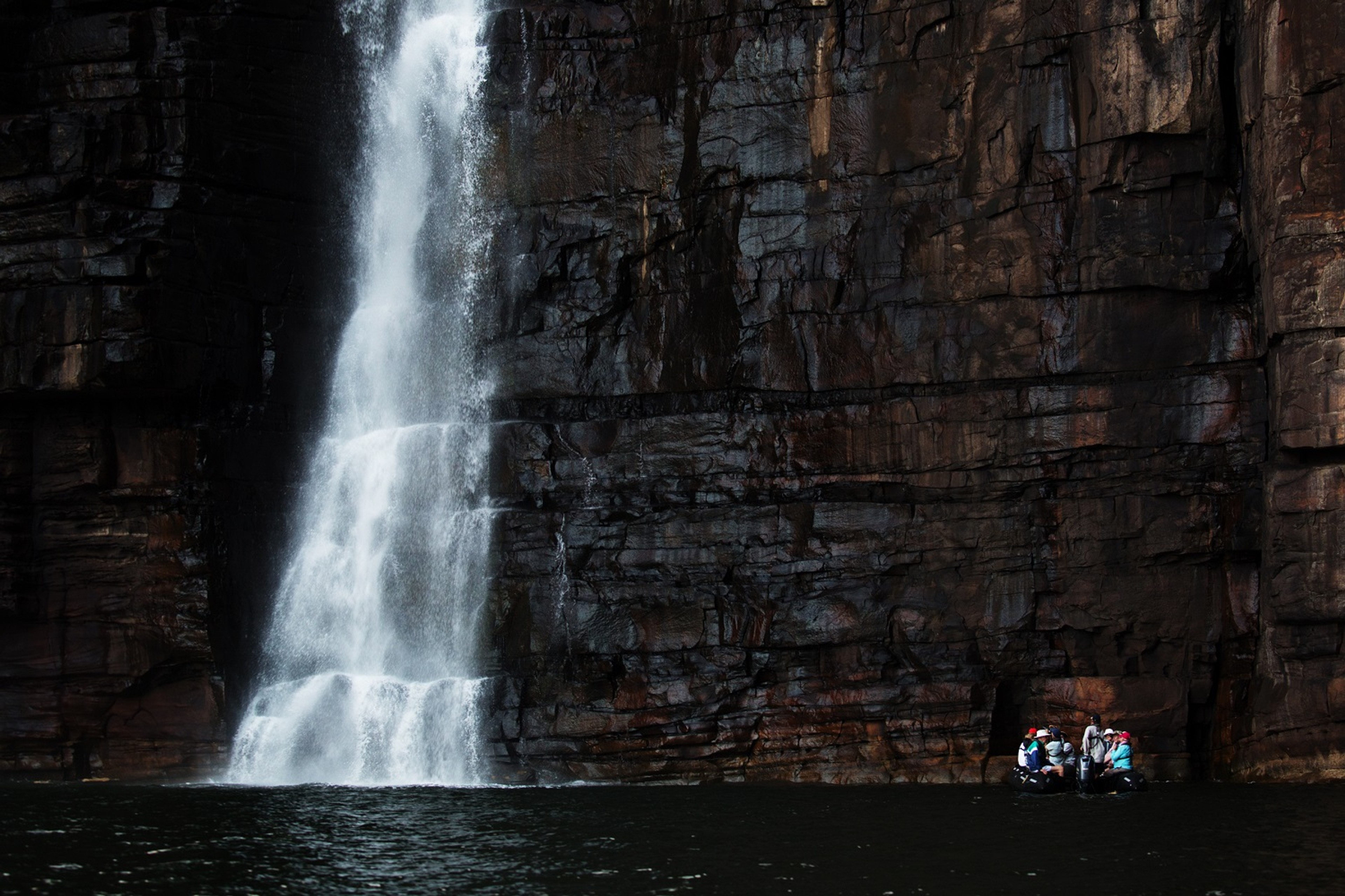 A Zodiac against the huge wall of water./Denis Elterman