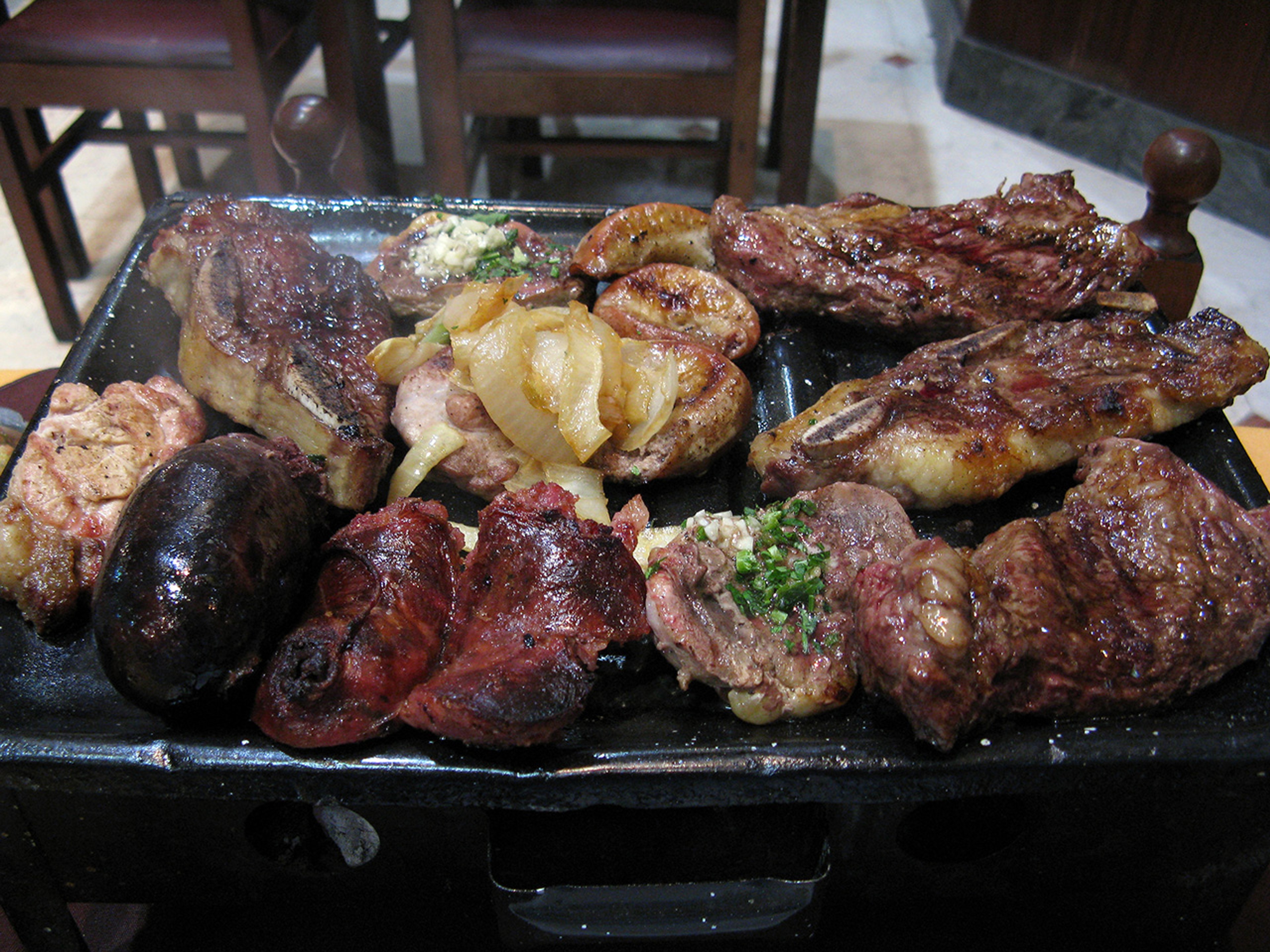 In Argentina, you'll find that a parrillada will give you choices of several types of meats./Wikimedia Commons photo by Diego Torres Silvestre