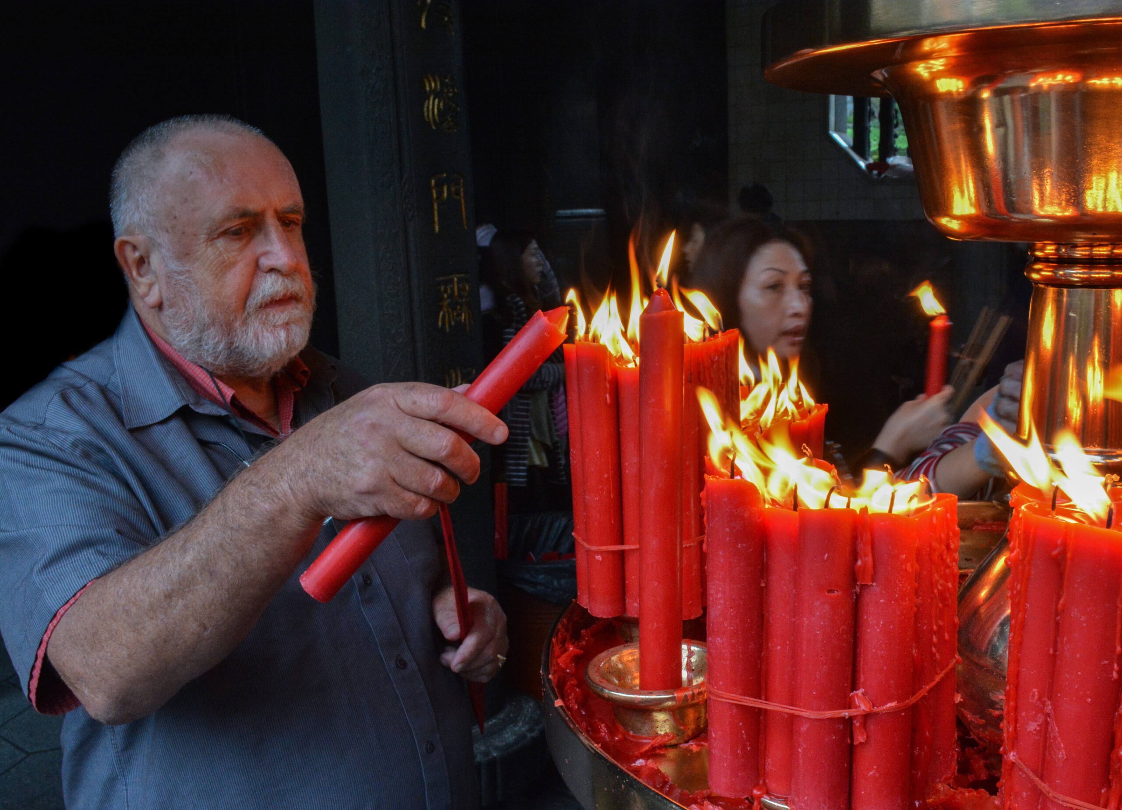The author's father finds a moment of peace in Bao'An Temple in Taipei, Photo by Ronan O'Connell for Silversea