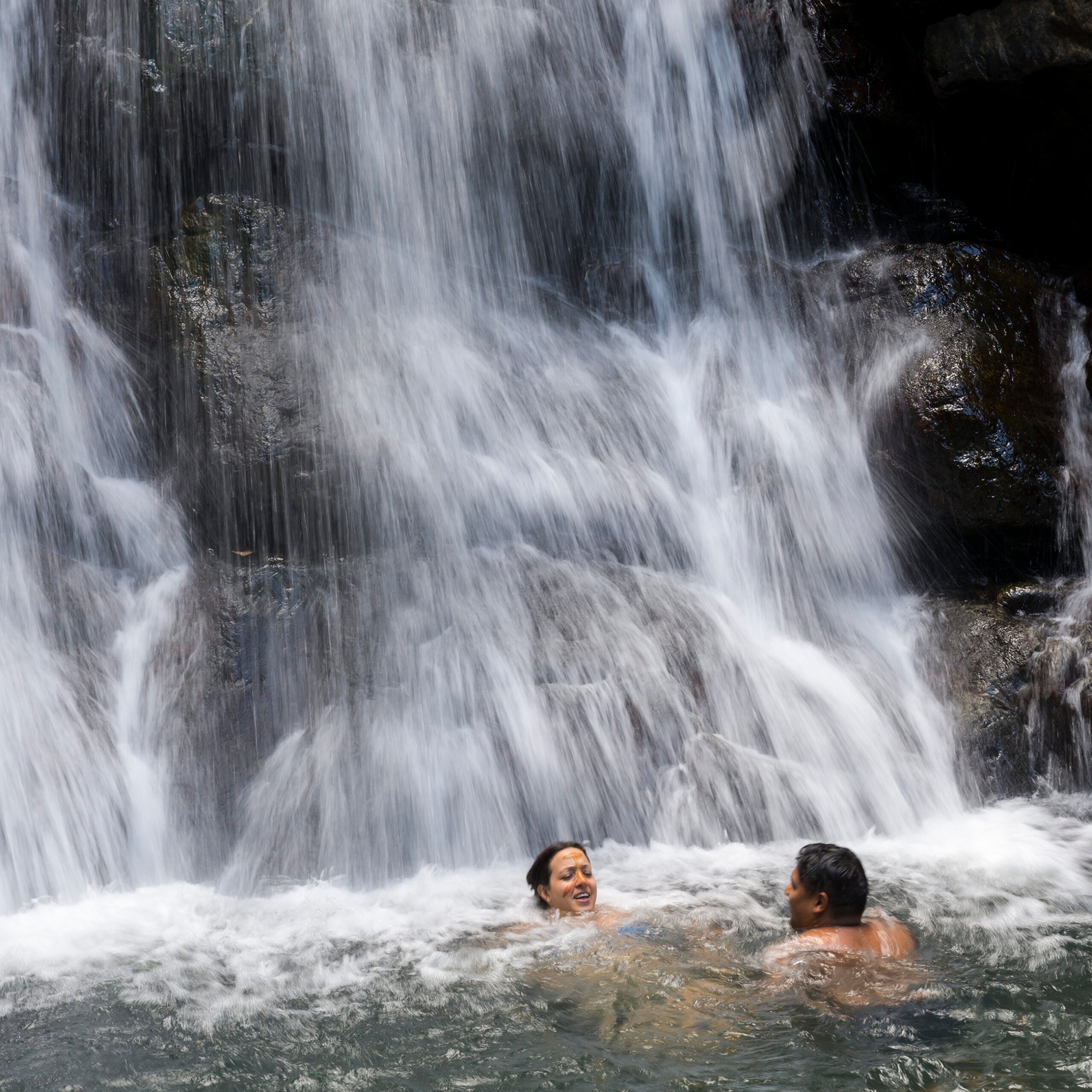 Swimmers at La Mina Falls at El Yunque National Forest in Puerto Rico/Getty Images
