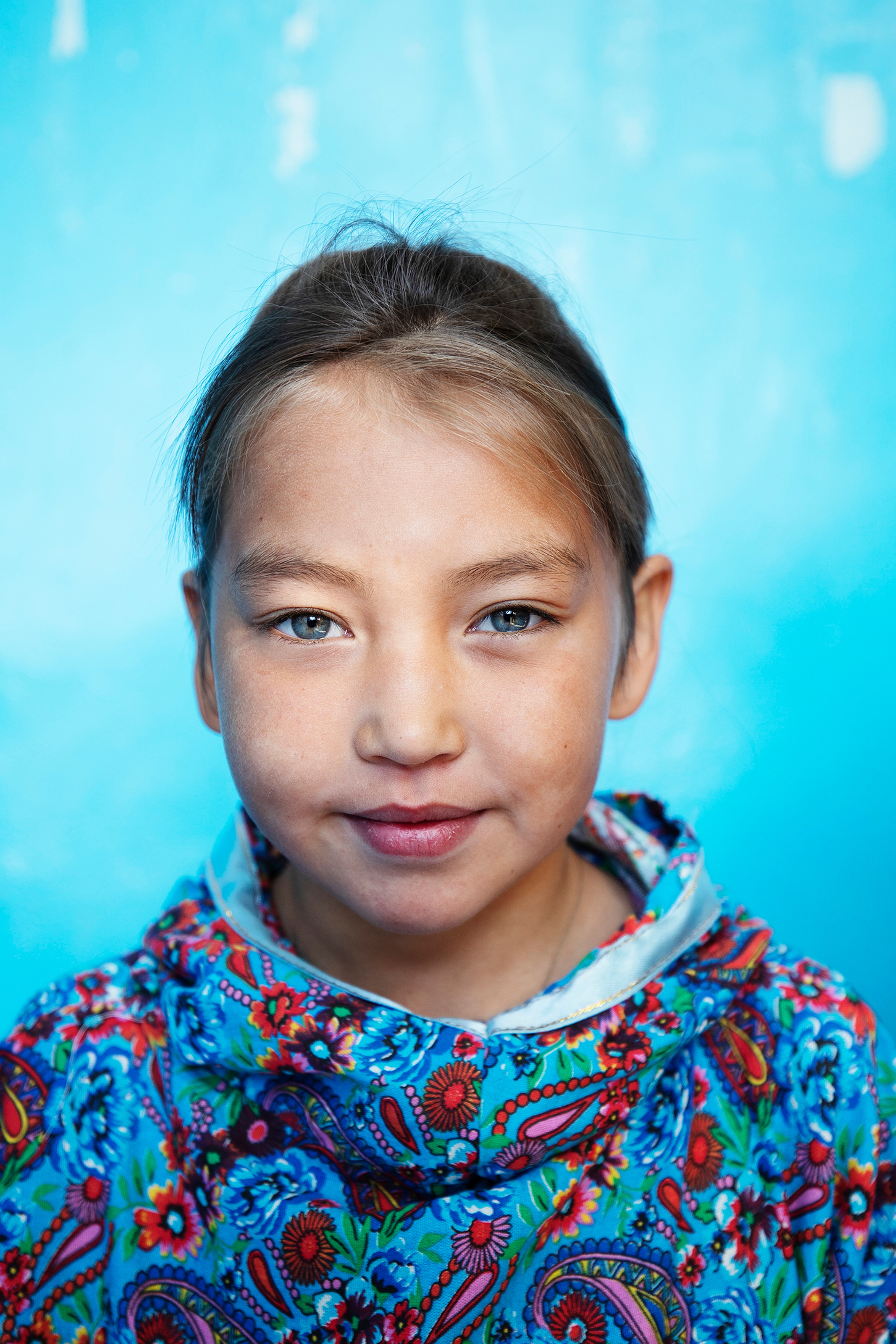 A young girl smiles, as Lucia Griggi captures the moment./Lucia Griggi