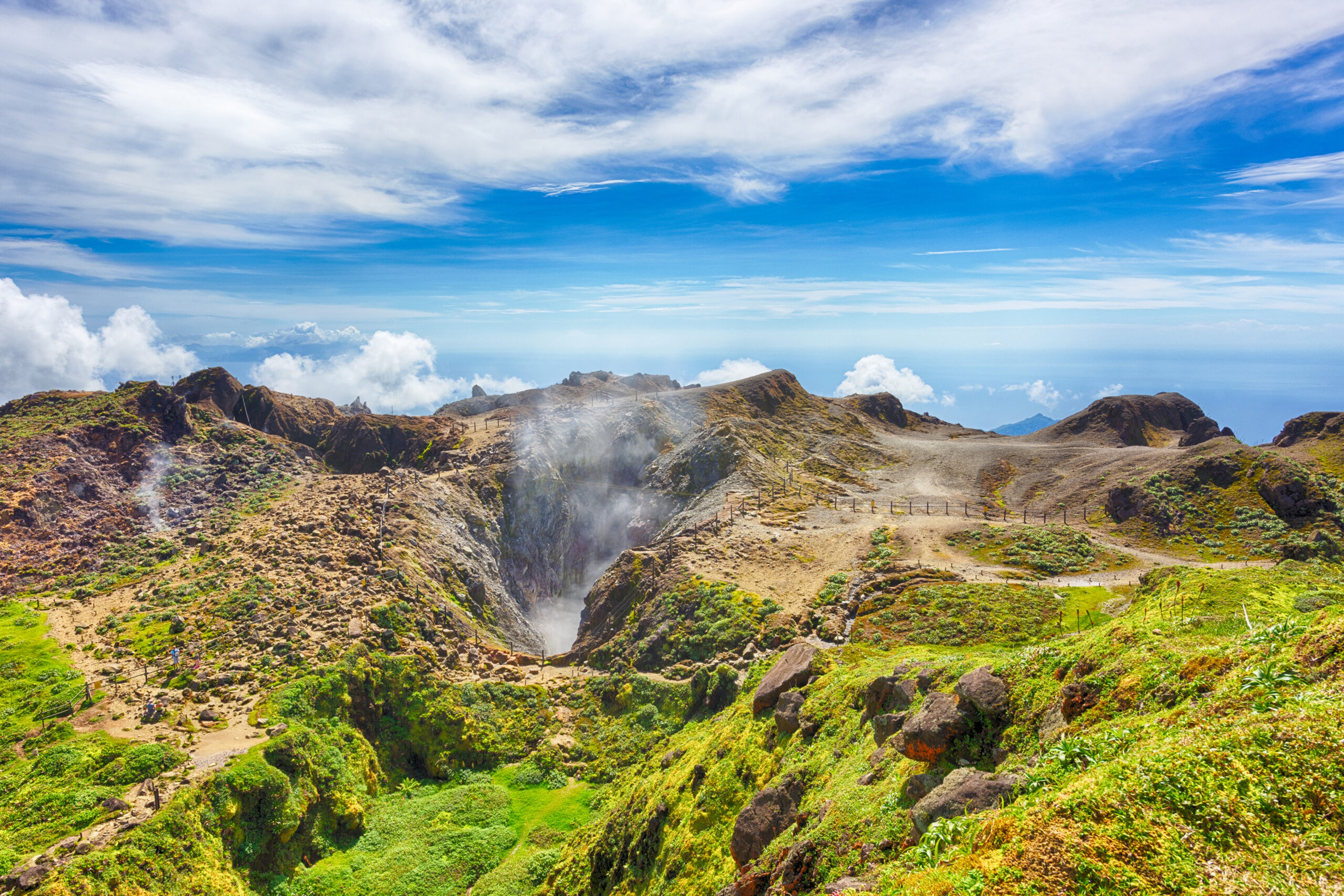 Steam rises from the crater of La Soufrière volcano on Guadeloupe./Shutterstock