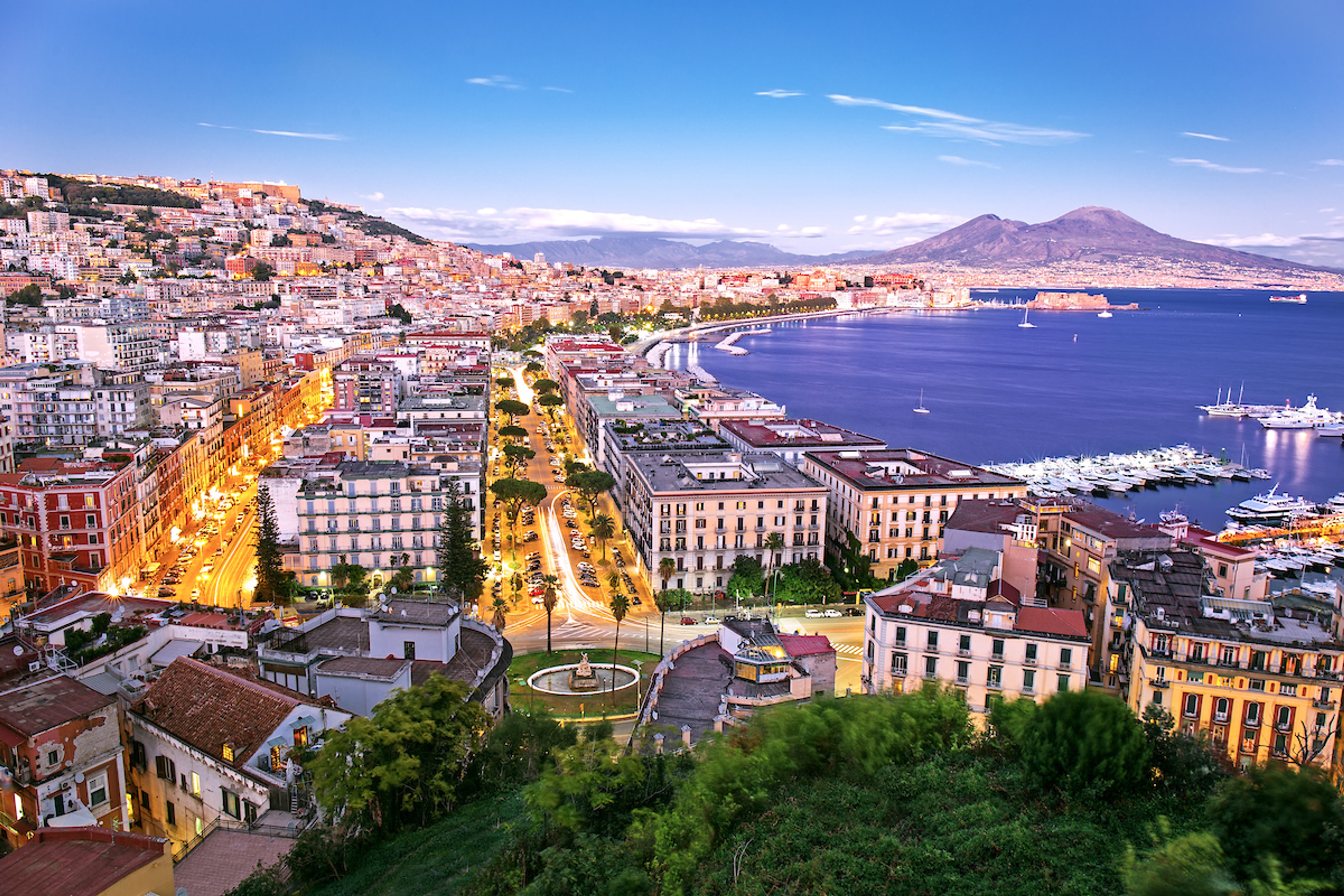 The city of Naples with the imposing sight of Mount Vesuvius in the distance/Shutterstock