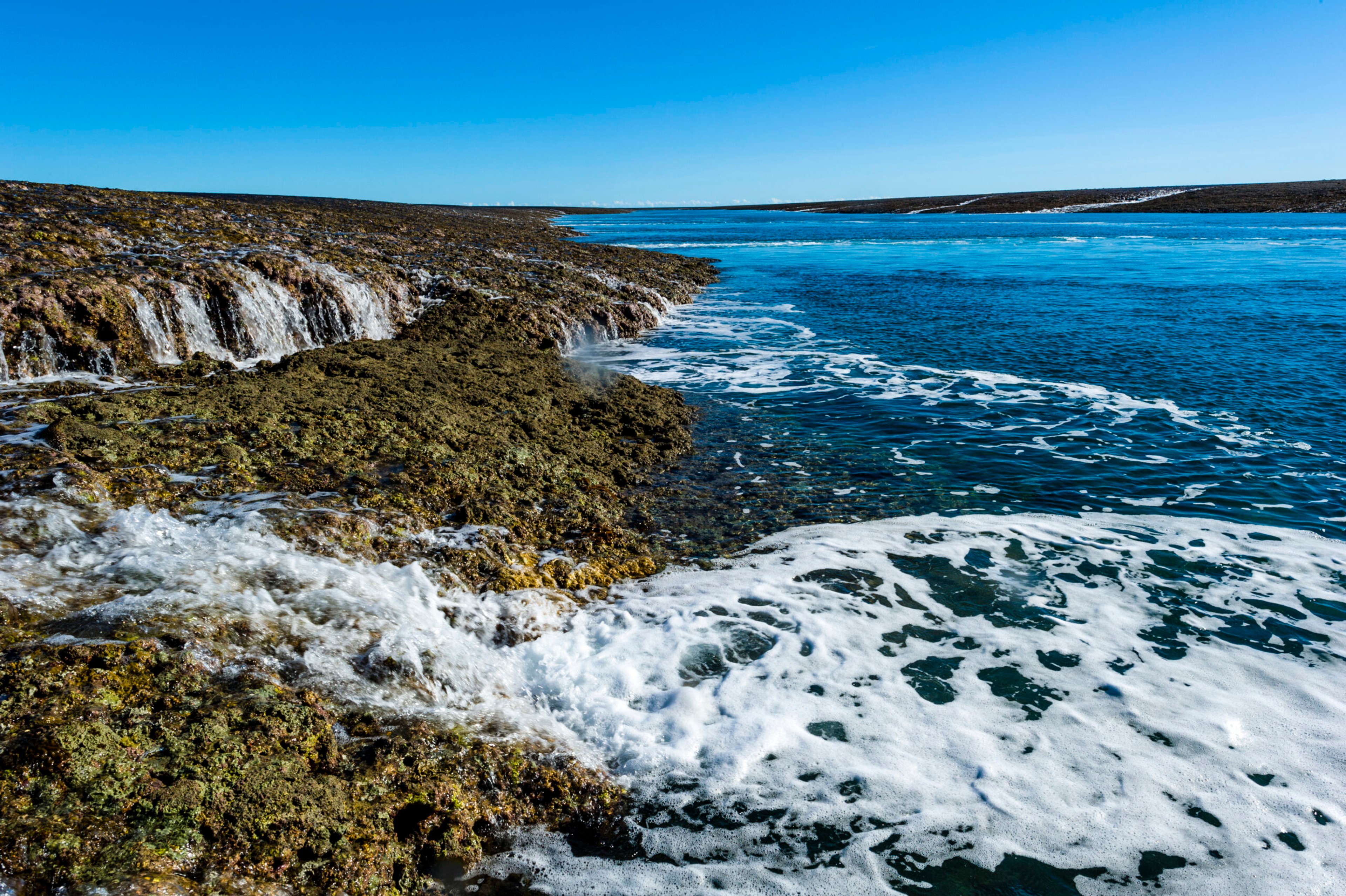 Water cascades from the Montgomery Reef at low tide in the Kimberley, Australia./Getty Images