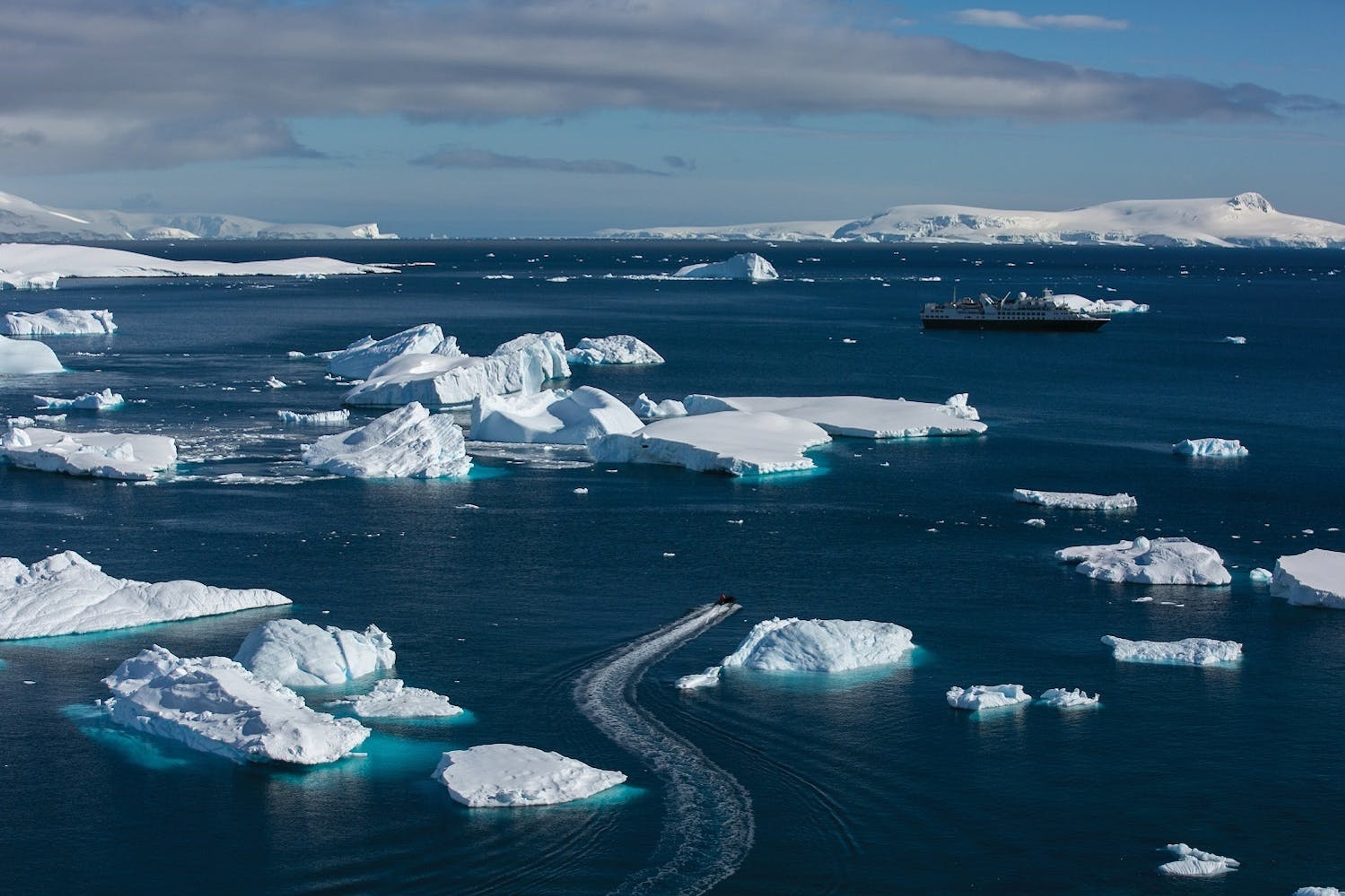 A Zodiac returns to Silver Explorer near Cuverville Island in Antarctica./Ray Stranagan