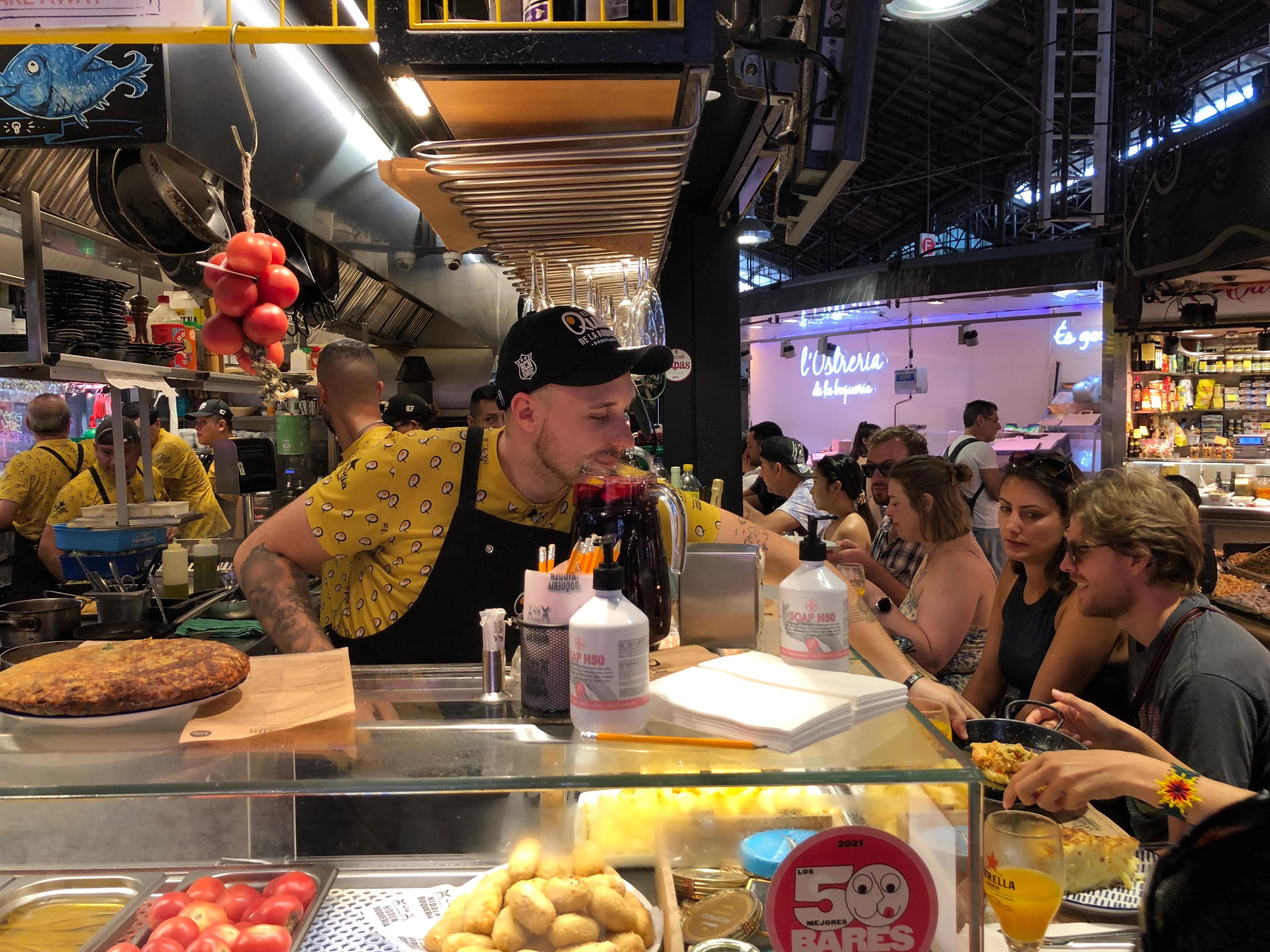 In Barcelona, El Quim de la Boquería serves up an extensive menu of market food made to order. Its specialty is fried eggs with foraged mushrooms, foie gras or gambas marinated in cava. /Photo by Jonathan Lerner for Silversea.