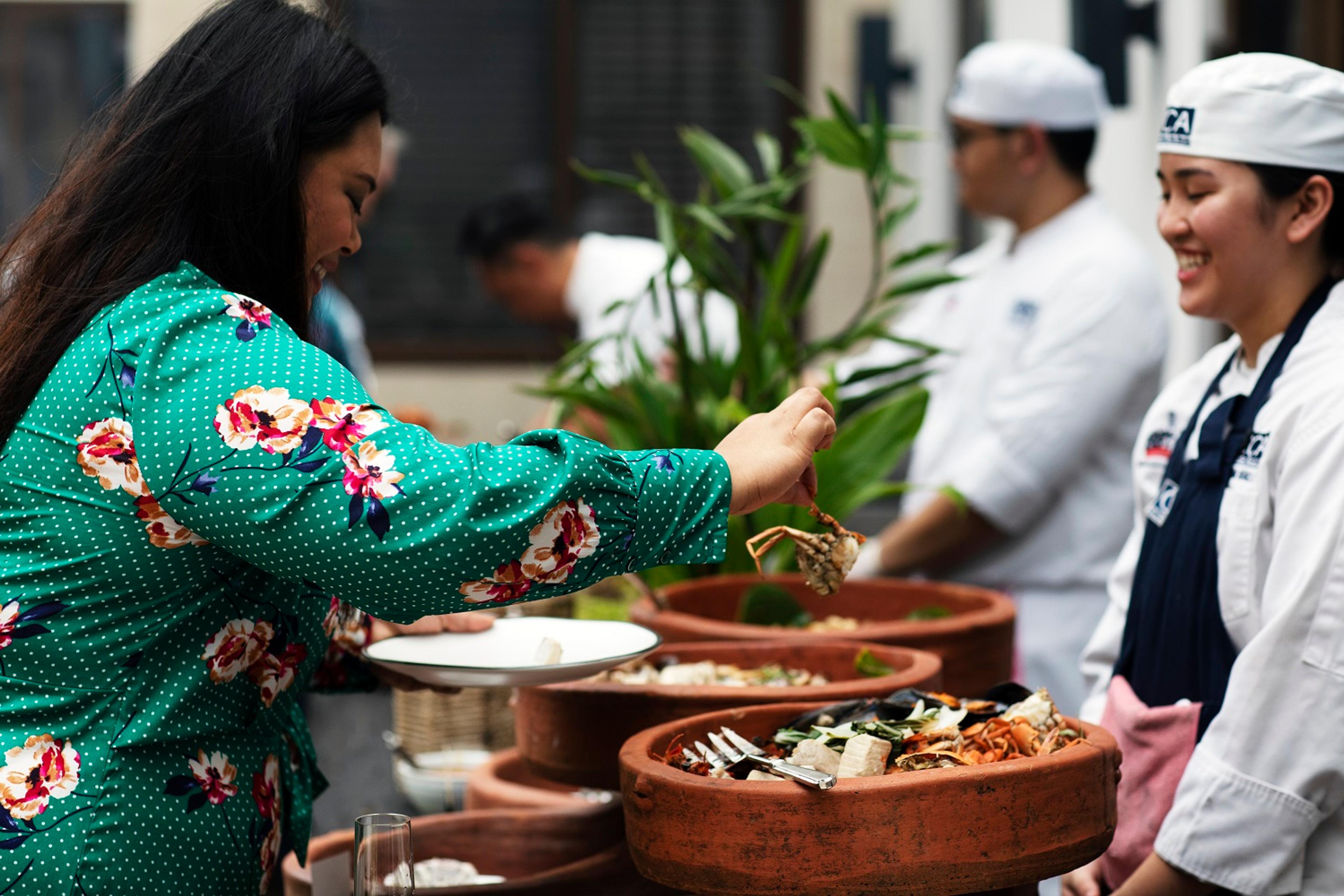 Ponseca enjoys Filipino cuisine at a S.A.L.T. experience in Manila./Lucia Griggi