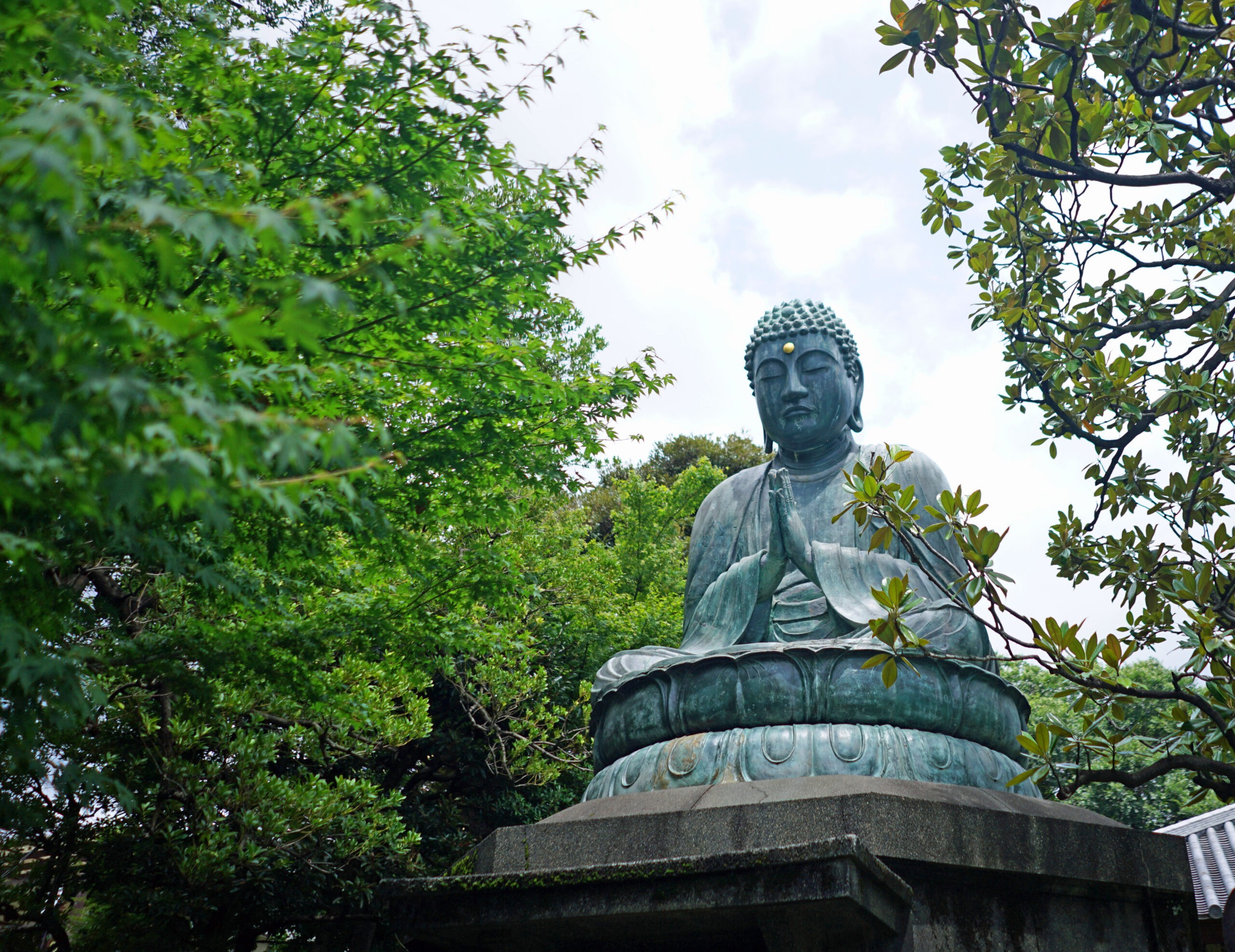 Buddah bronze sculpture at Tennoji Temple in the Yanaka district of Taito in Tokyo./Shutterstock