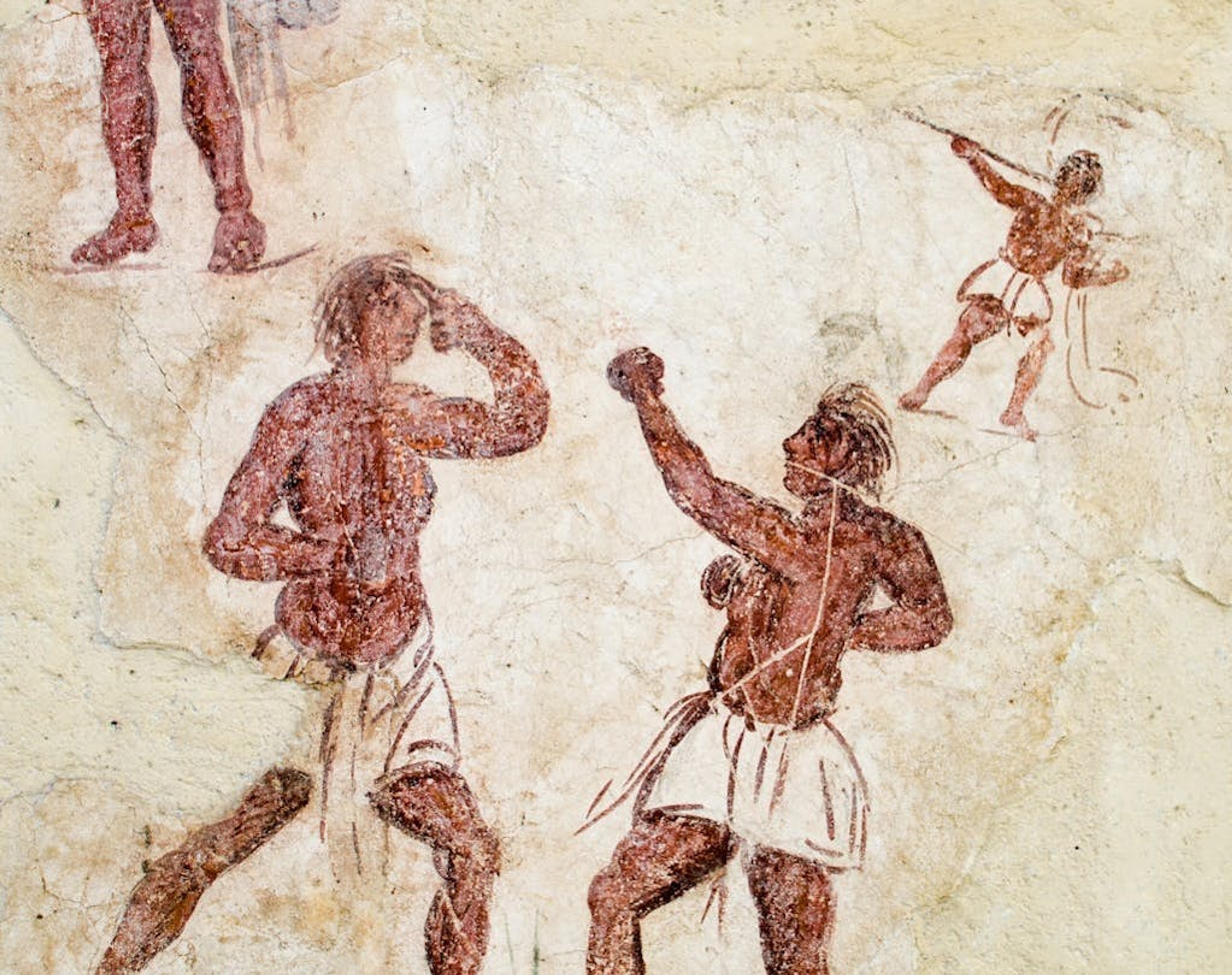 A 3000-year-old Greek fresco depicting boxers. Found in the island of Delos, Greece/Getty Images