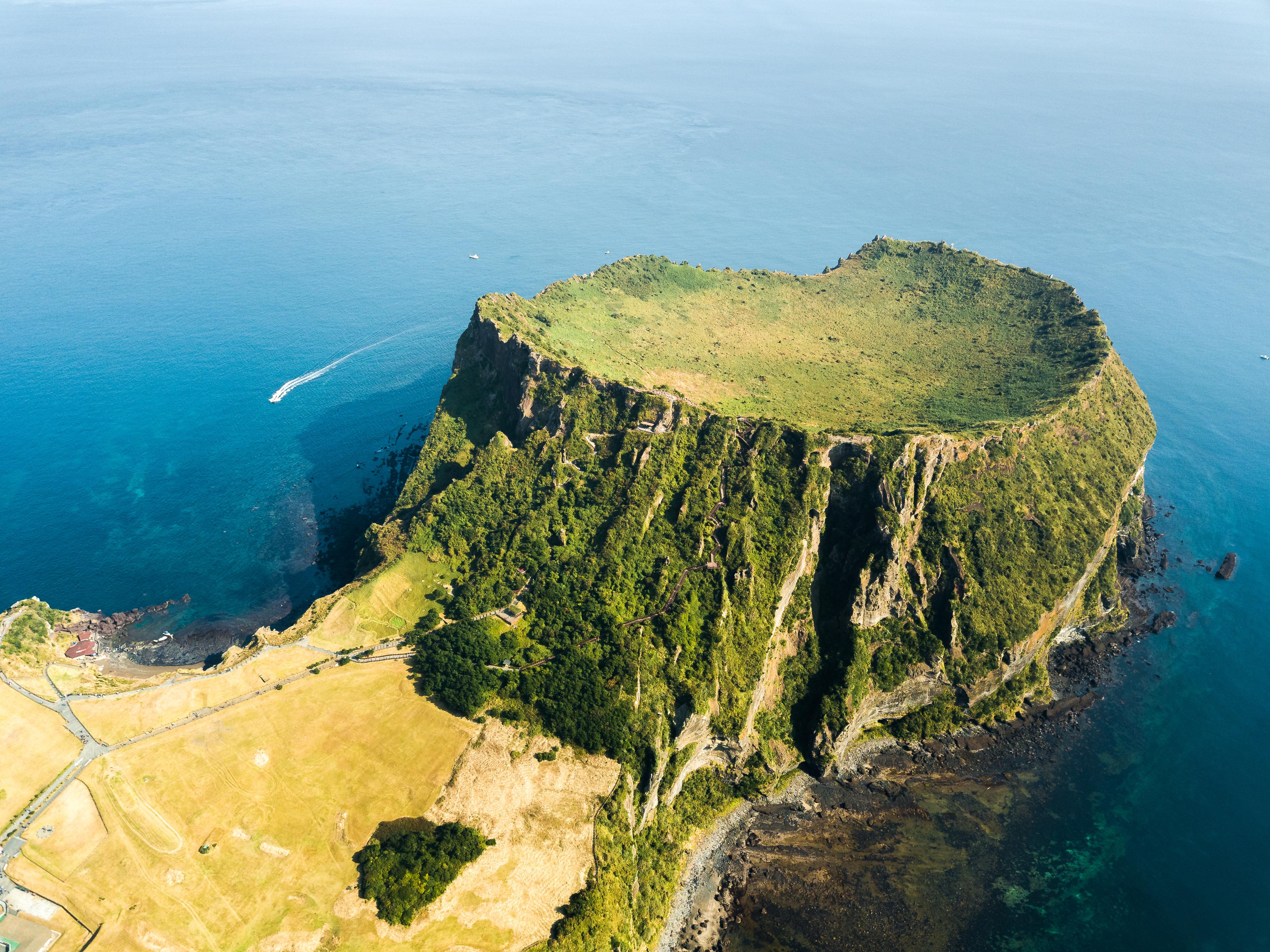 On Jeju, the Seongsan Ilchulbong Tuff Cone rises almost 600 feet above sea level, thanks to a magma flow almost 5,000 years ago./Getty Images