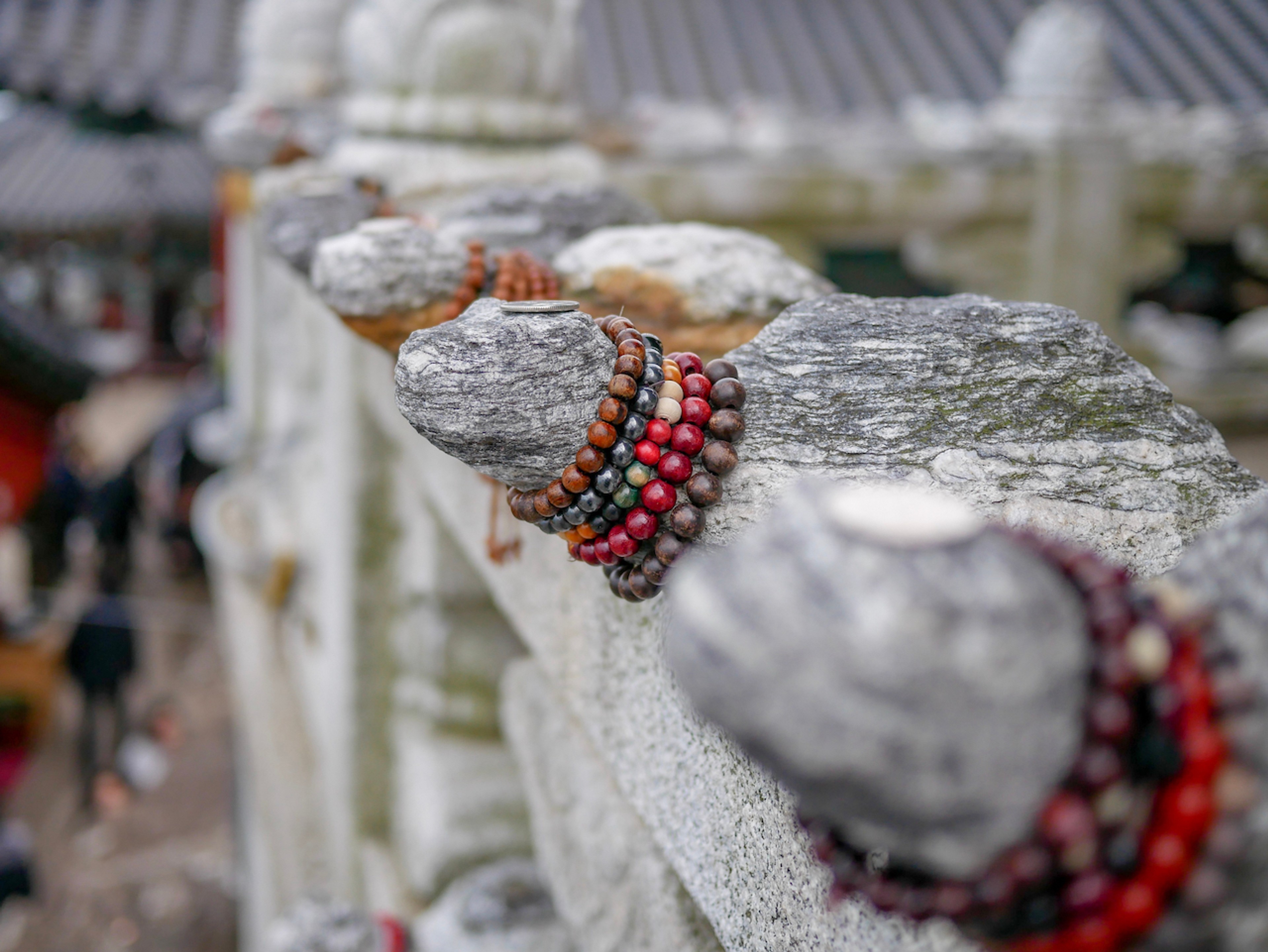 Prayer beads wrapped around the necks of turtle statues in Hyangiram temple./Shutterstock