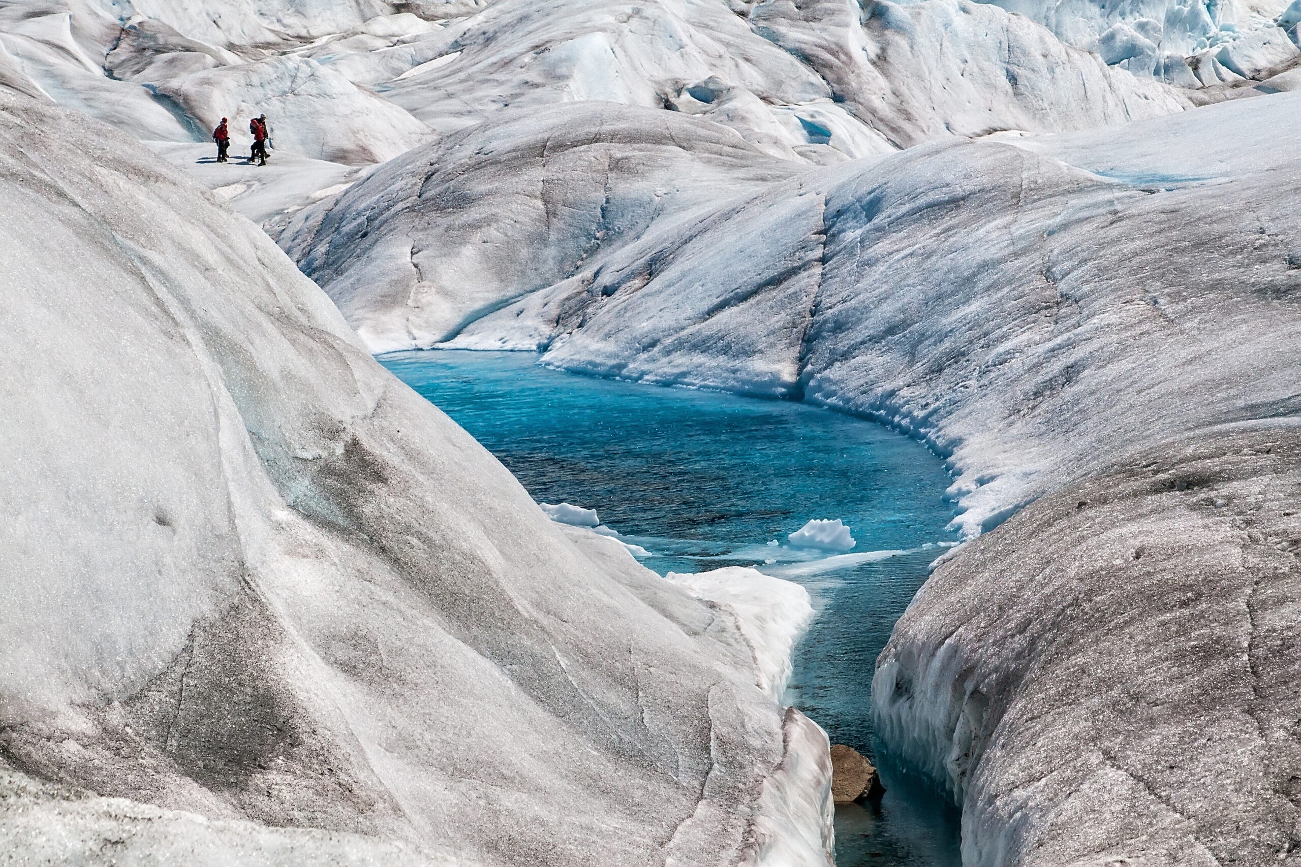 You might think twice about taking a dip in a bone-chilling glacial pool and just admire it from afar, like this view at Mendenhall Glacier near Juneau./Shutterstock