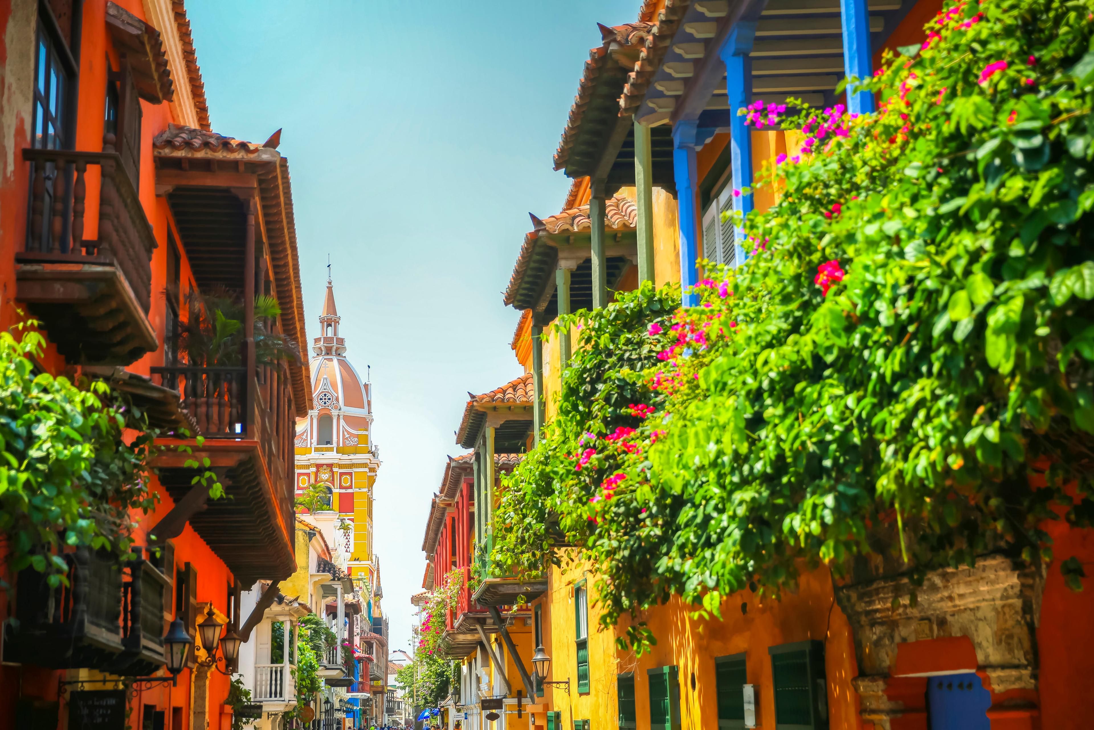 Lush balcony planters along the street looking toward town square in the old town of Cartagena/Getty Images