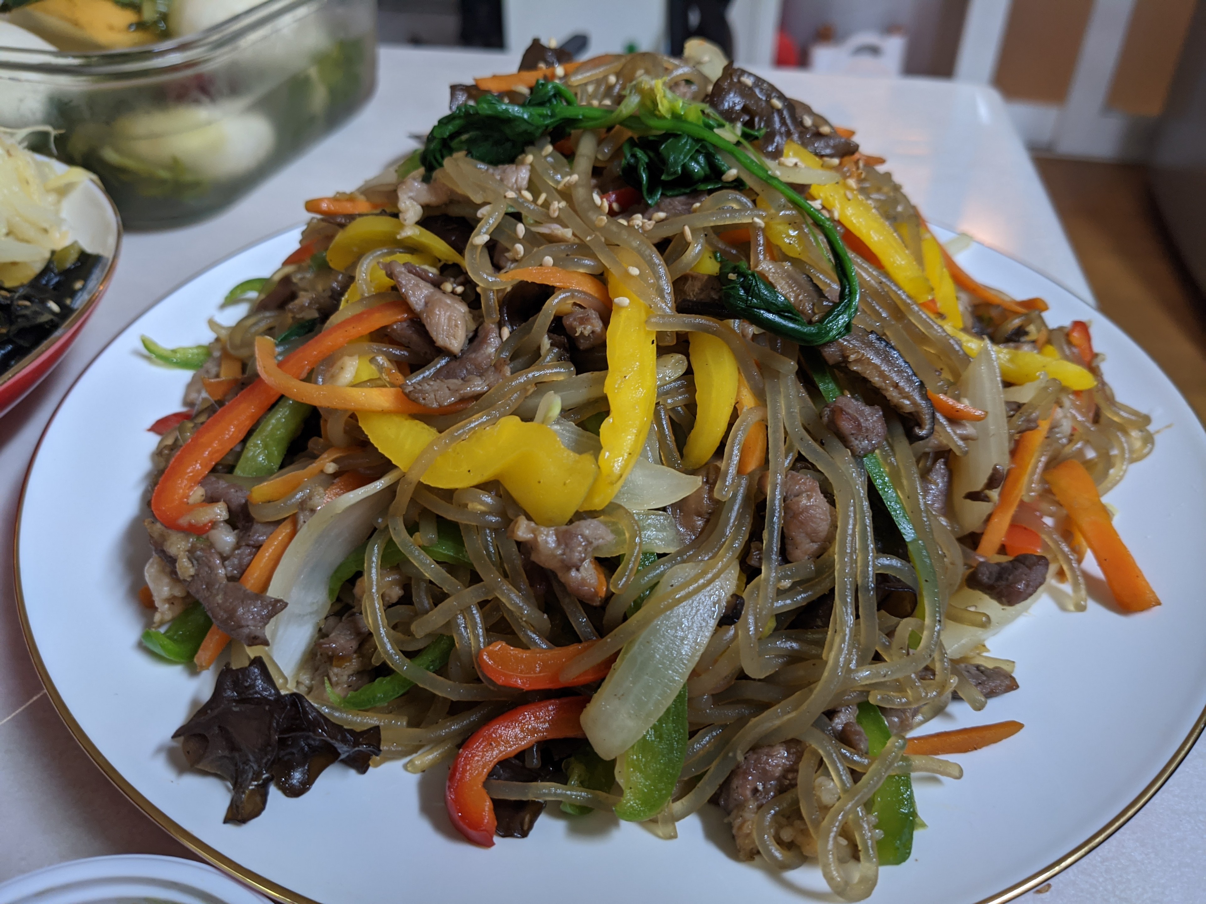 Japchae, a warm pile of clear glass noodles mixed with tender meat or seafood, along with sautéed mushrooms and grilled vegetables, is a staple of Korean food./Andrew Evans