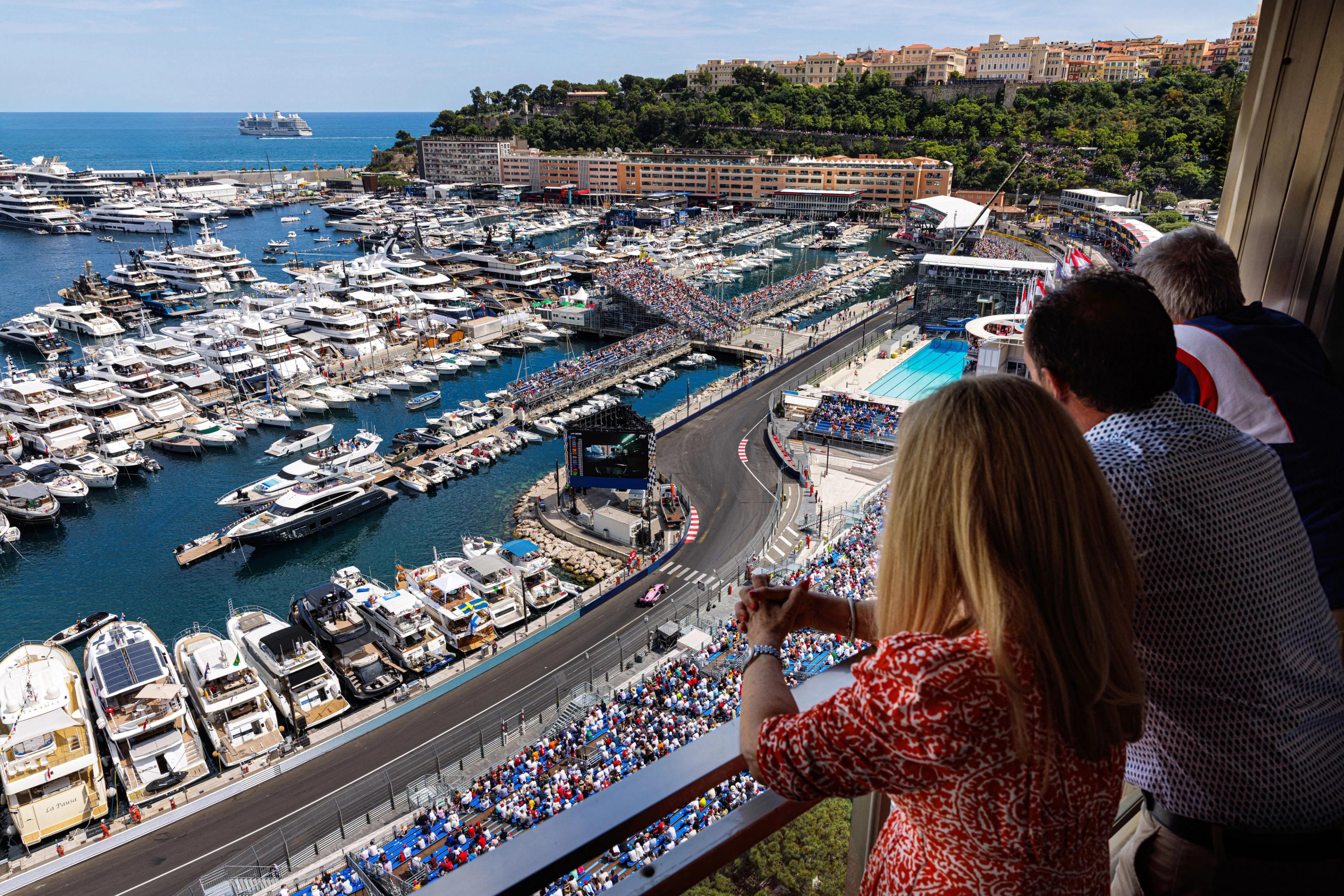 Guests watching Monaco Grand Prix from the terraces of the luxury apartments.