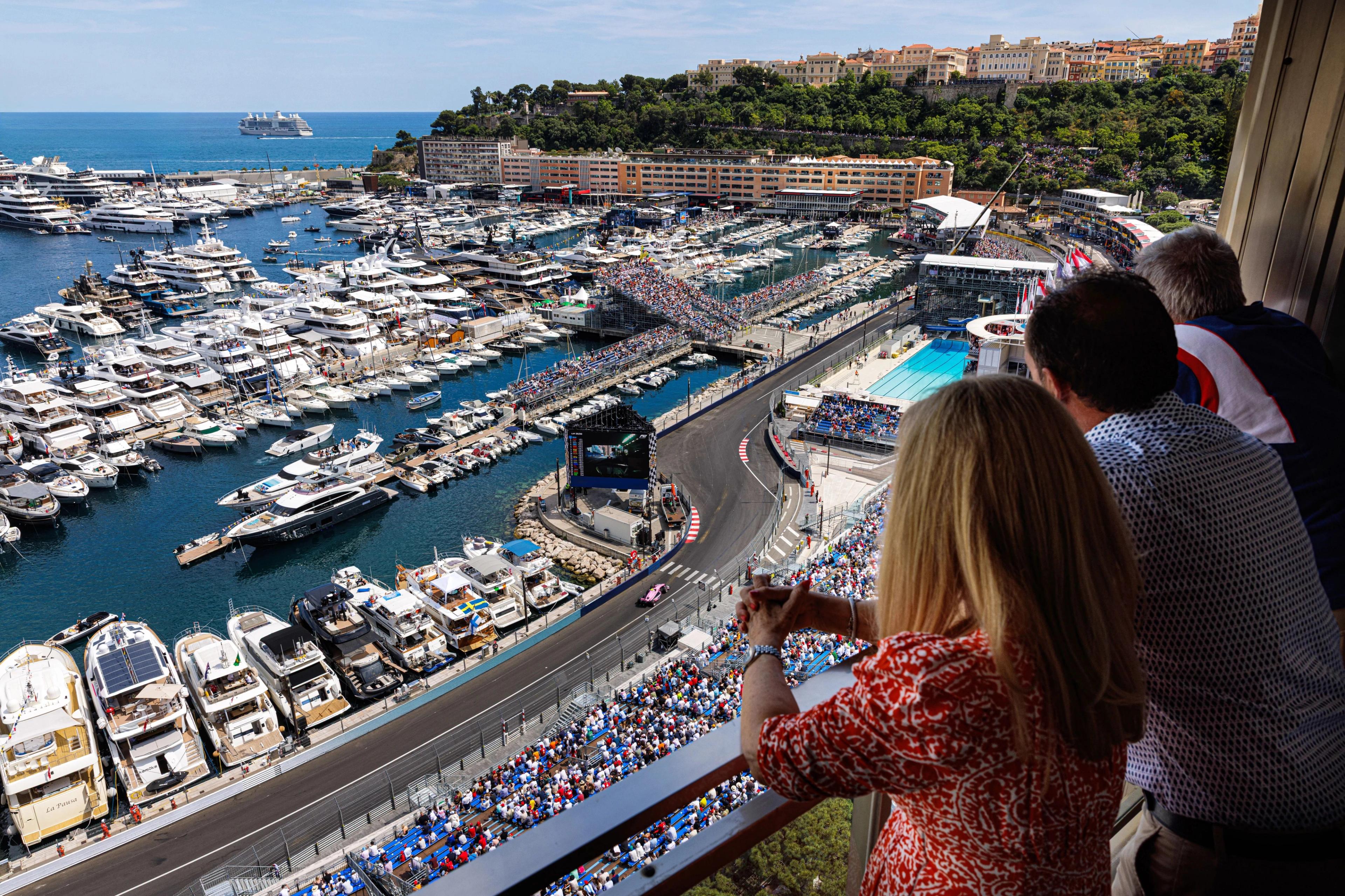 Guests watching Monaco Grand Prix from the terraces of the luxury apartments.