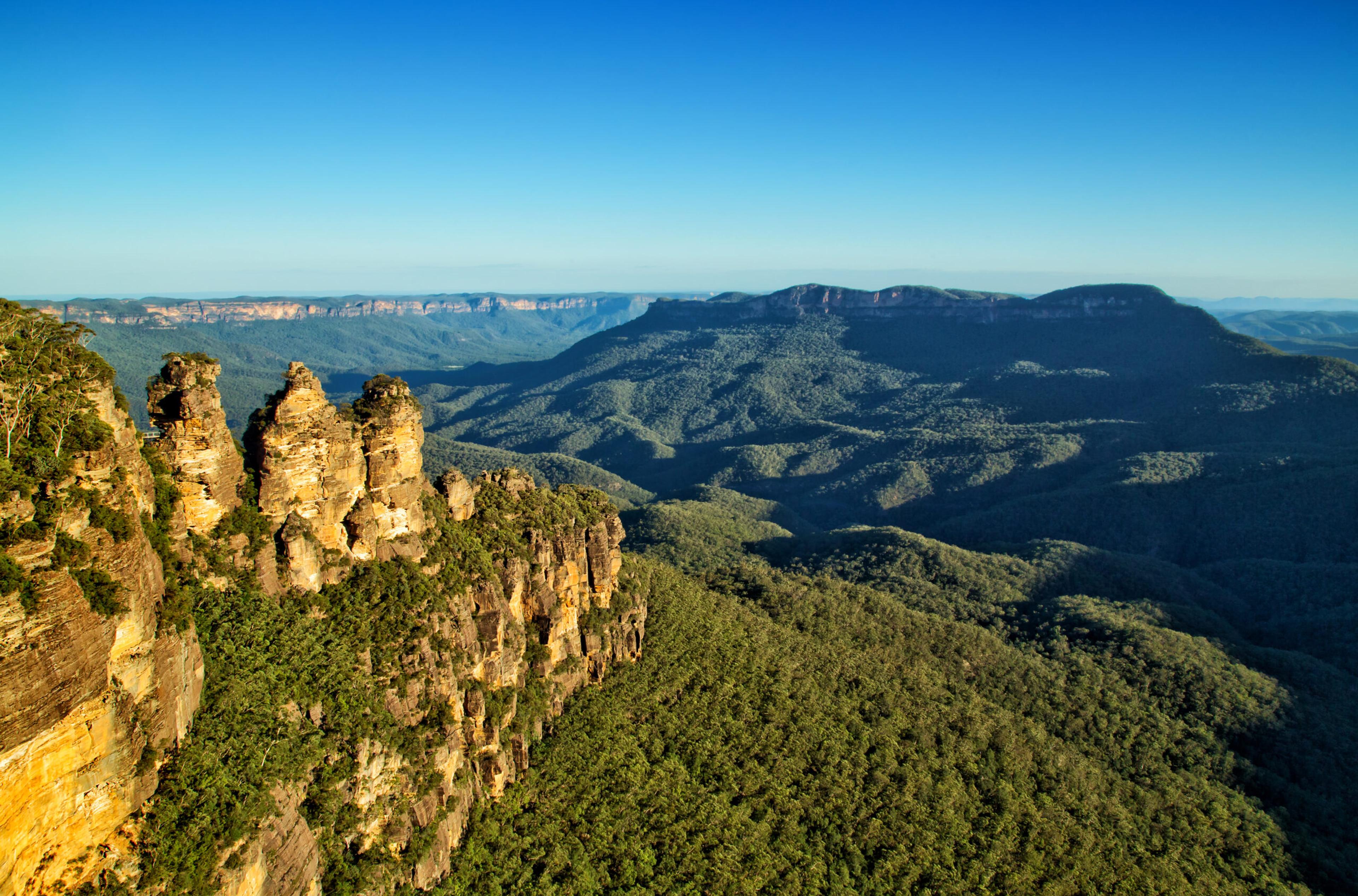 The Three Sisters rock formation at left in the Blue Mountains National Park, about 60 miles west of Sydney./Shutterstock