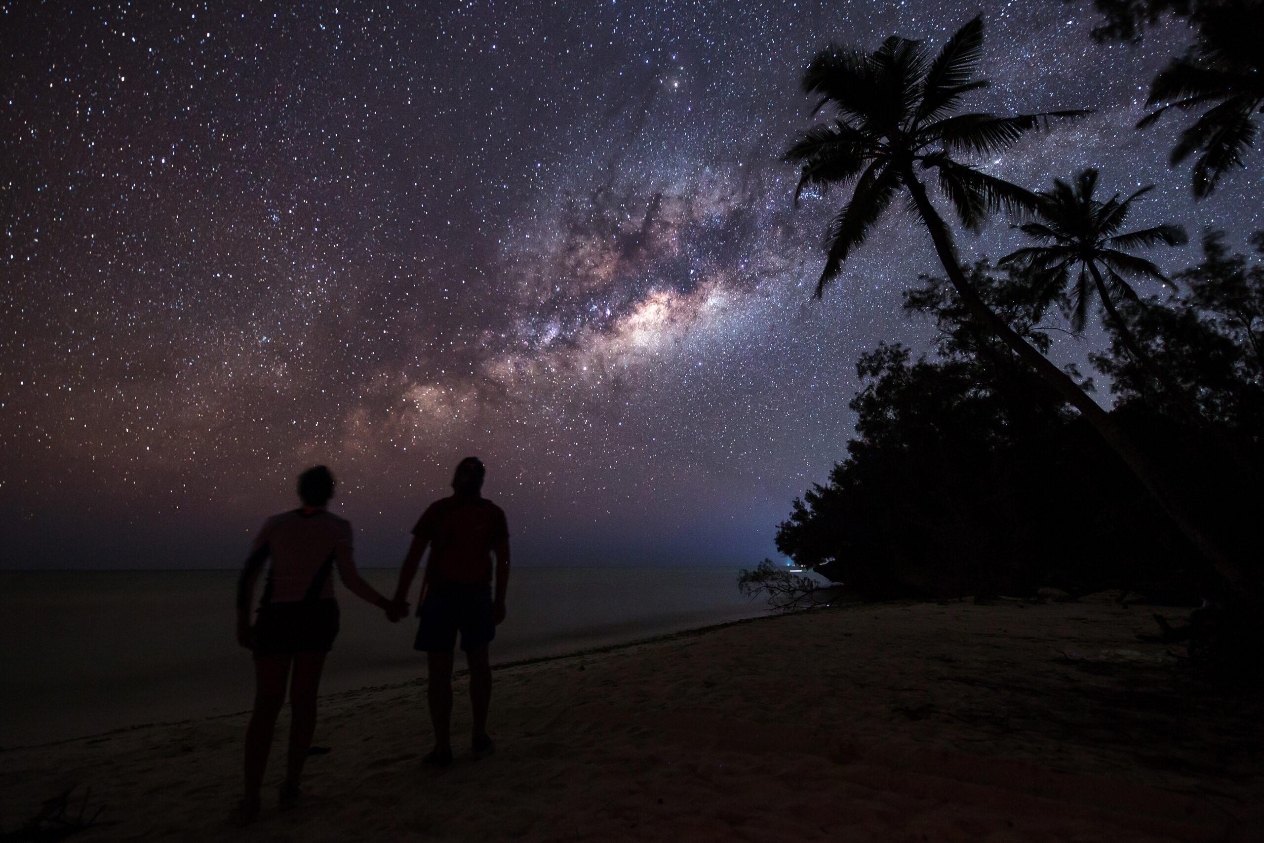 A couple stargazes in Zanzibar, off Tanzania, where Silversea expedition cruises call./Shutterstock