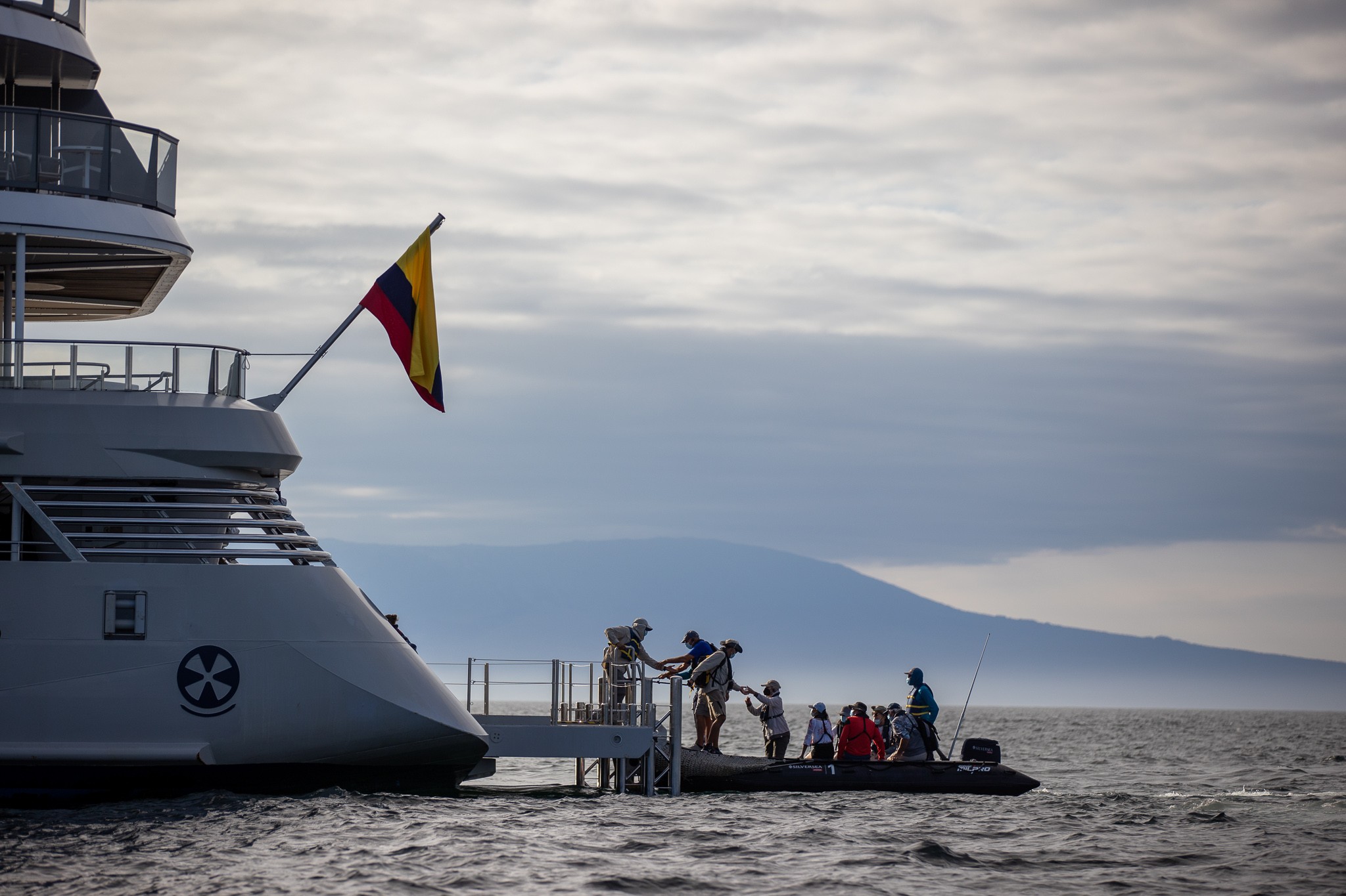 Passengers embark on Zodiacs from the ship's Marina.
