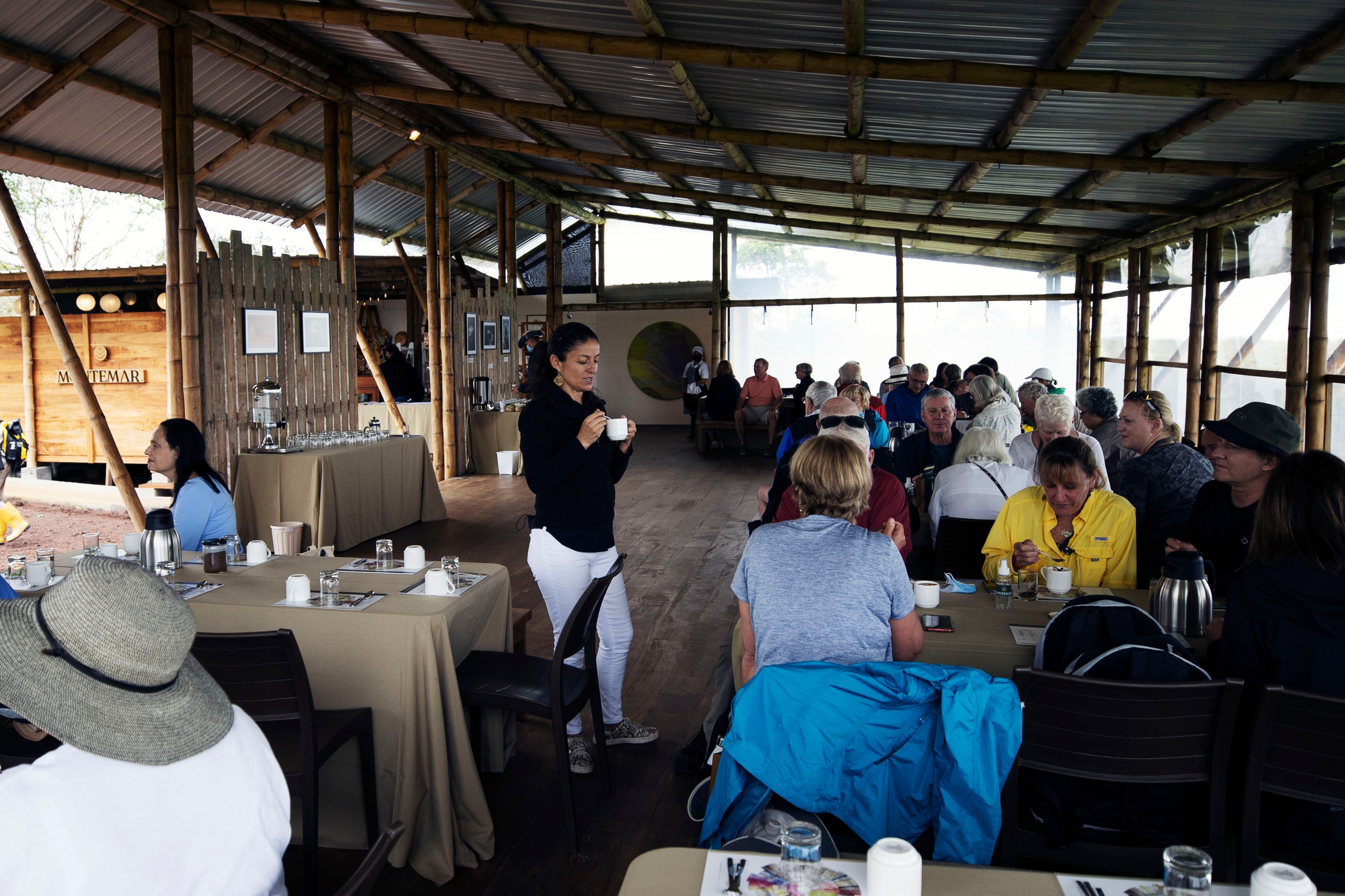 Reyna Oleas, founder of Montemar Coffee, shares a cup of coffee with Silversea guests./Lucia Griggi