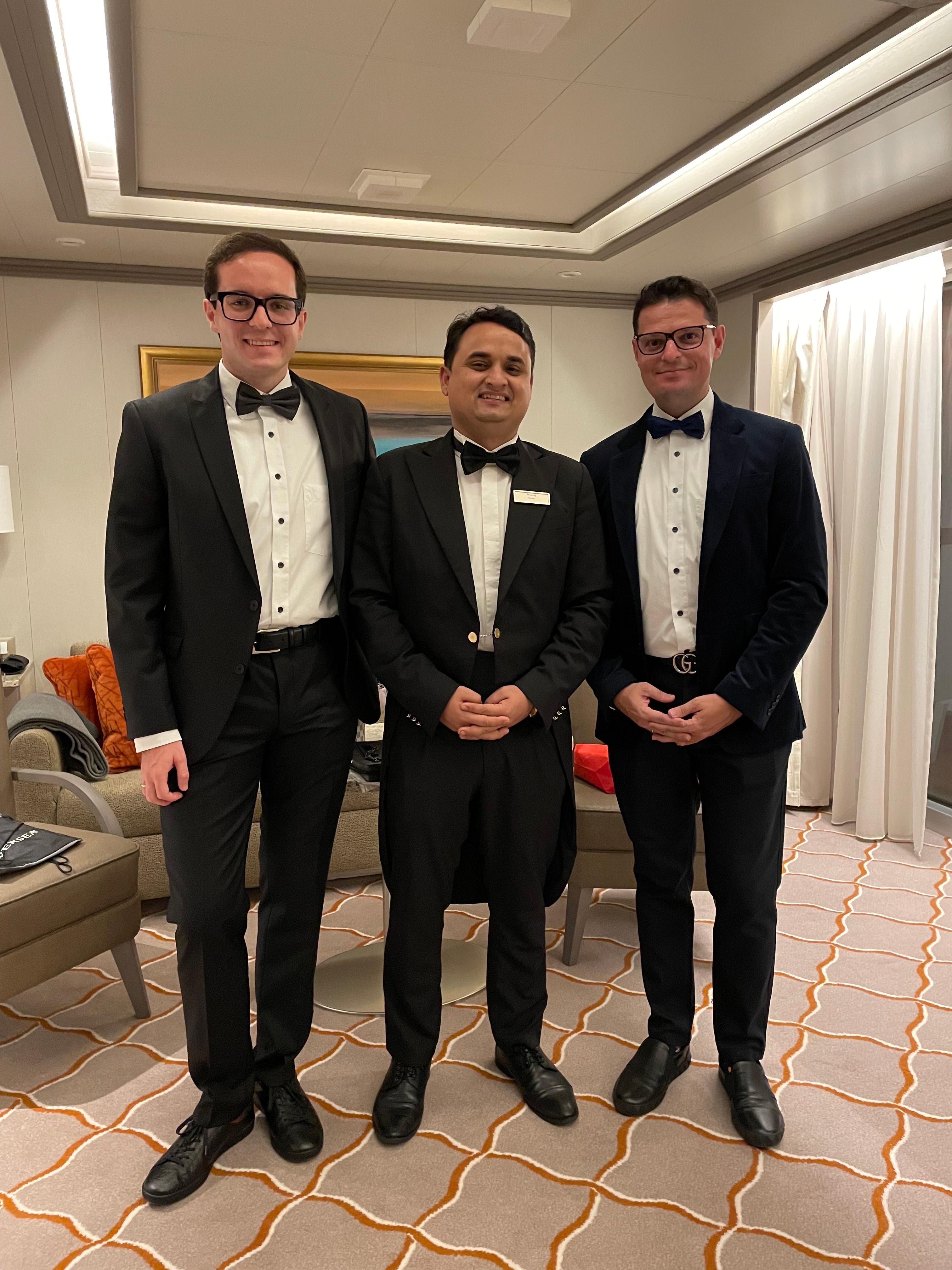 Johannes and Orkan Baerenfaenger with their butler, Neeraj, on Silver Moon.