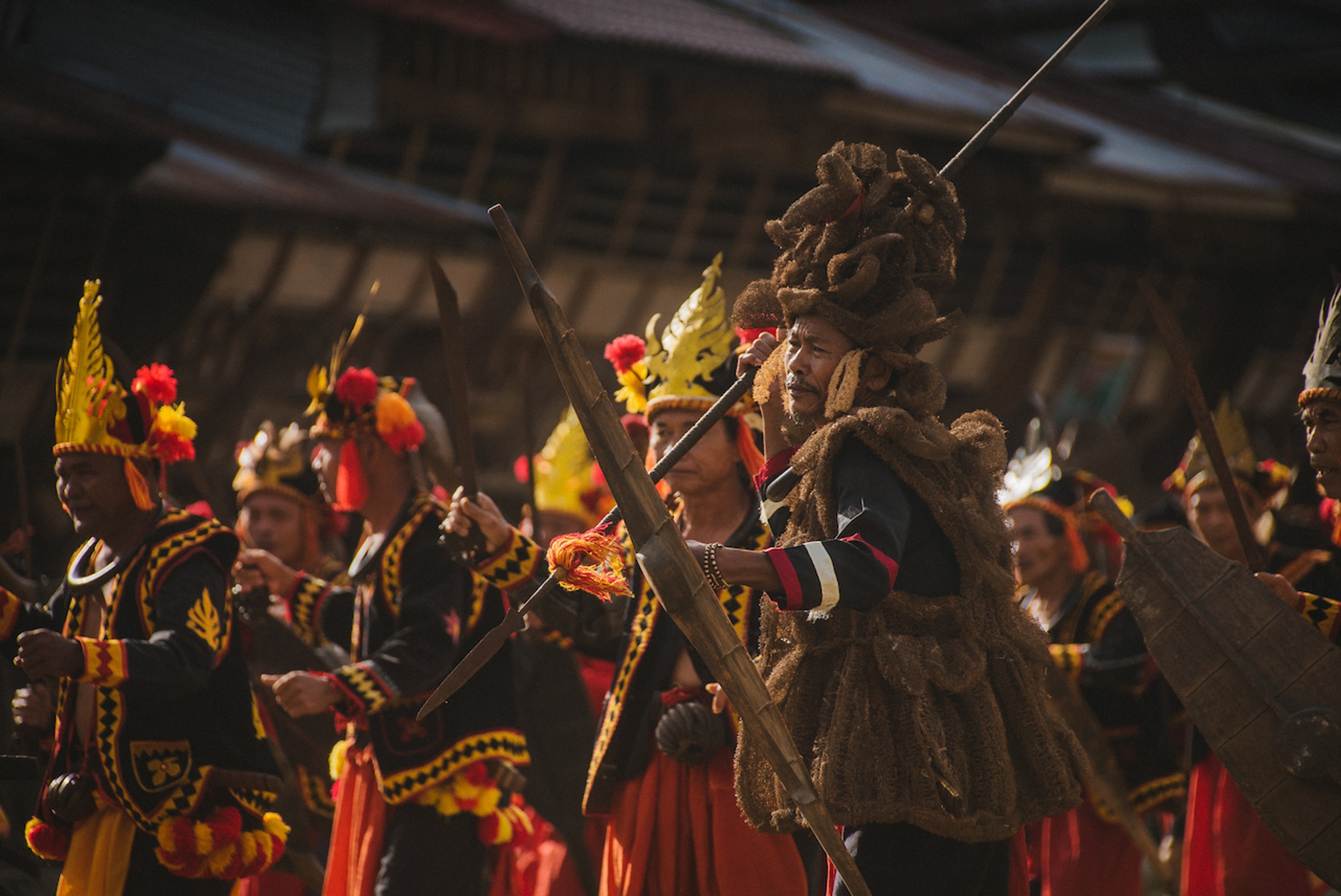 The locals' striking costumes add color to the tradition of stone jumping/Willem Van den Heeve