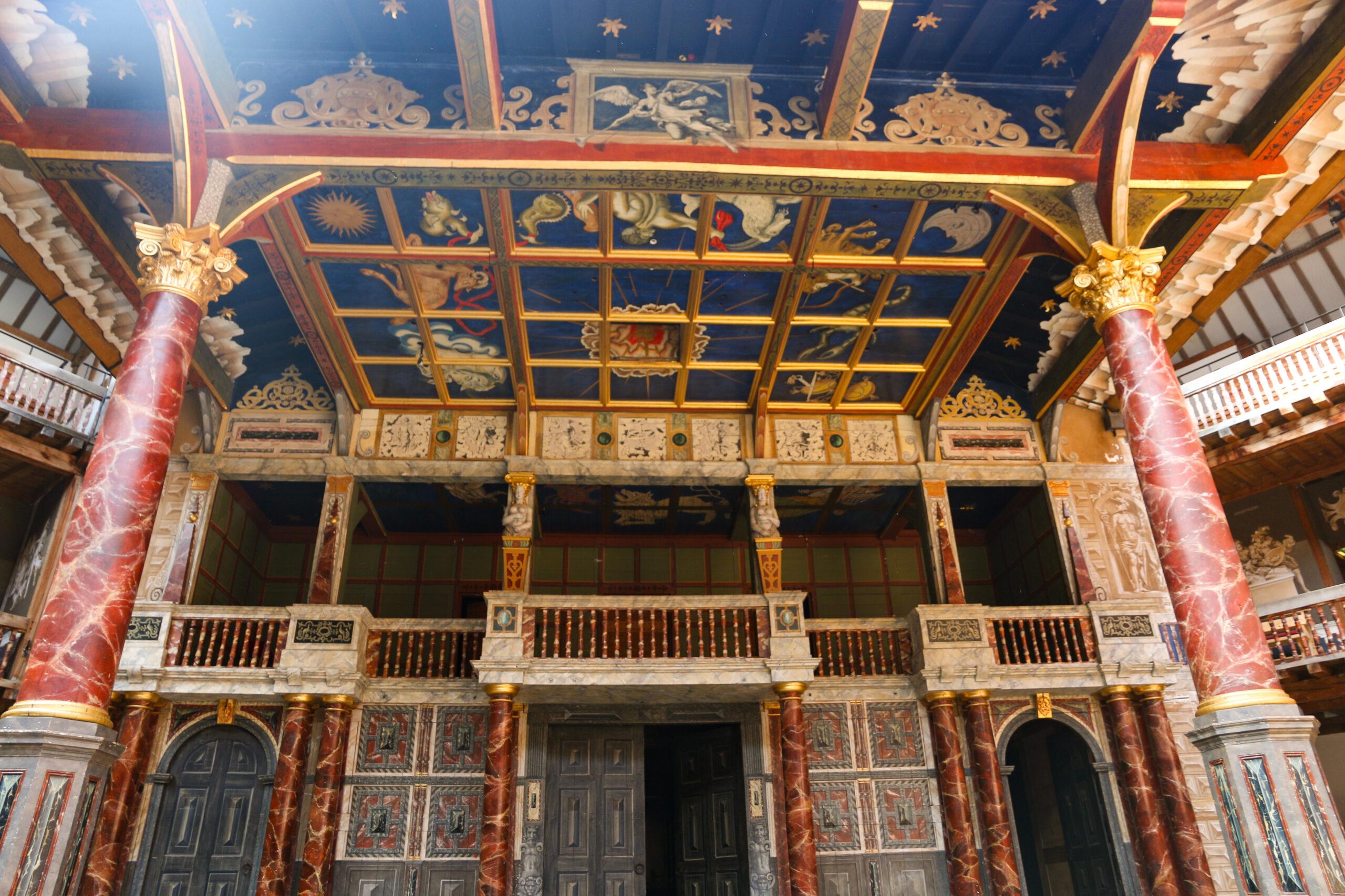 The Globe's stage roof decorated with pictures and symbols in the original theater in London/Getty Images