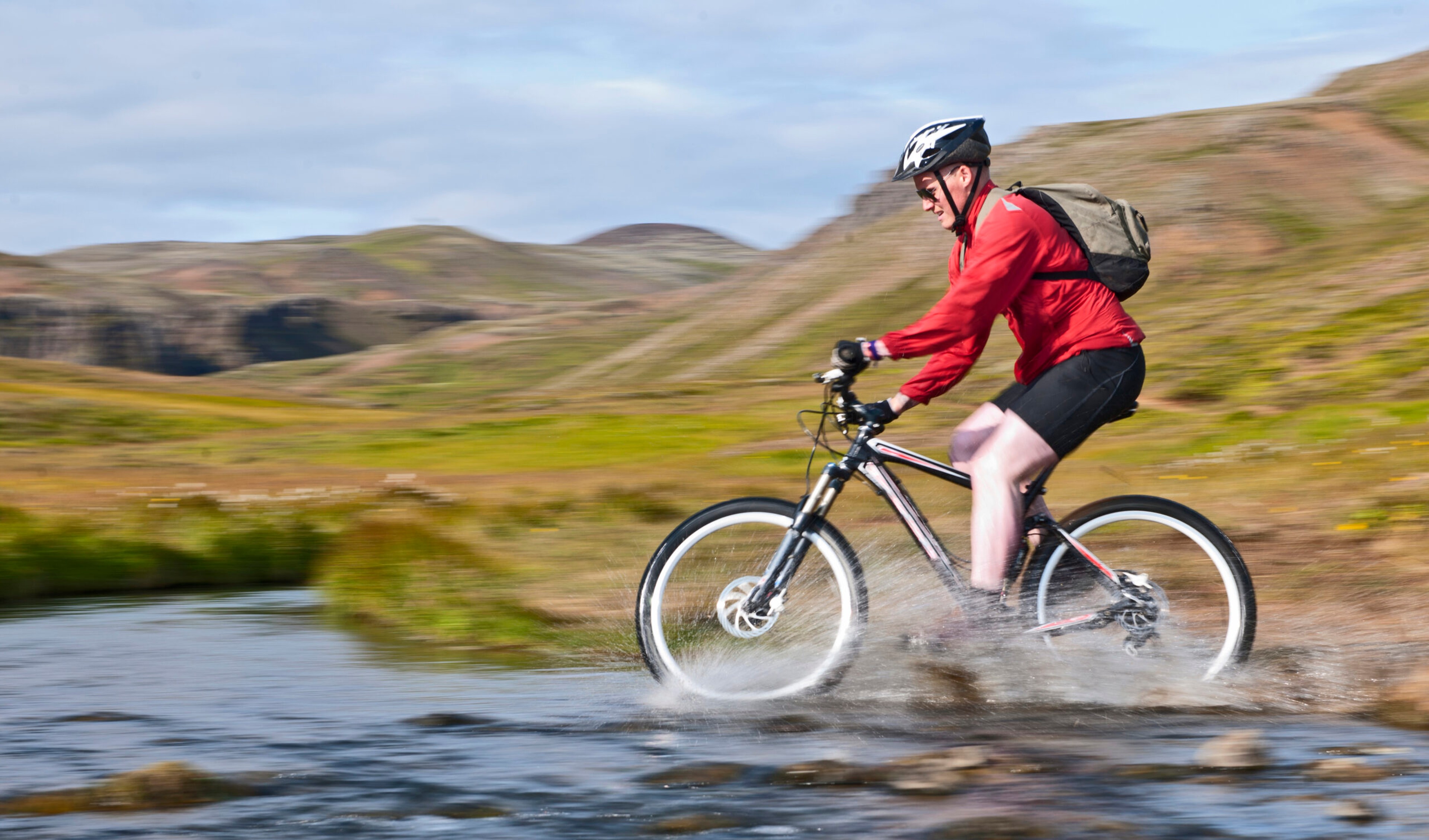 Biking around Reykjadalur, Iceland, about 30 miles from Reykjavik, means you get to visit hot springs on two wheels./Getty Images