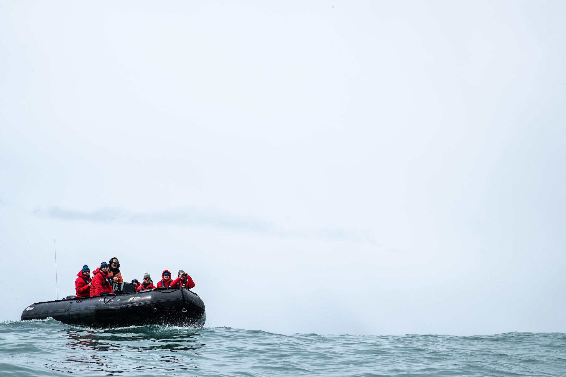 Silversea guests cruise to Gold Harbour onboard a Zodiac./Benn Berkeley