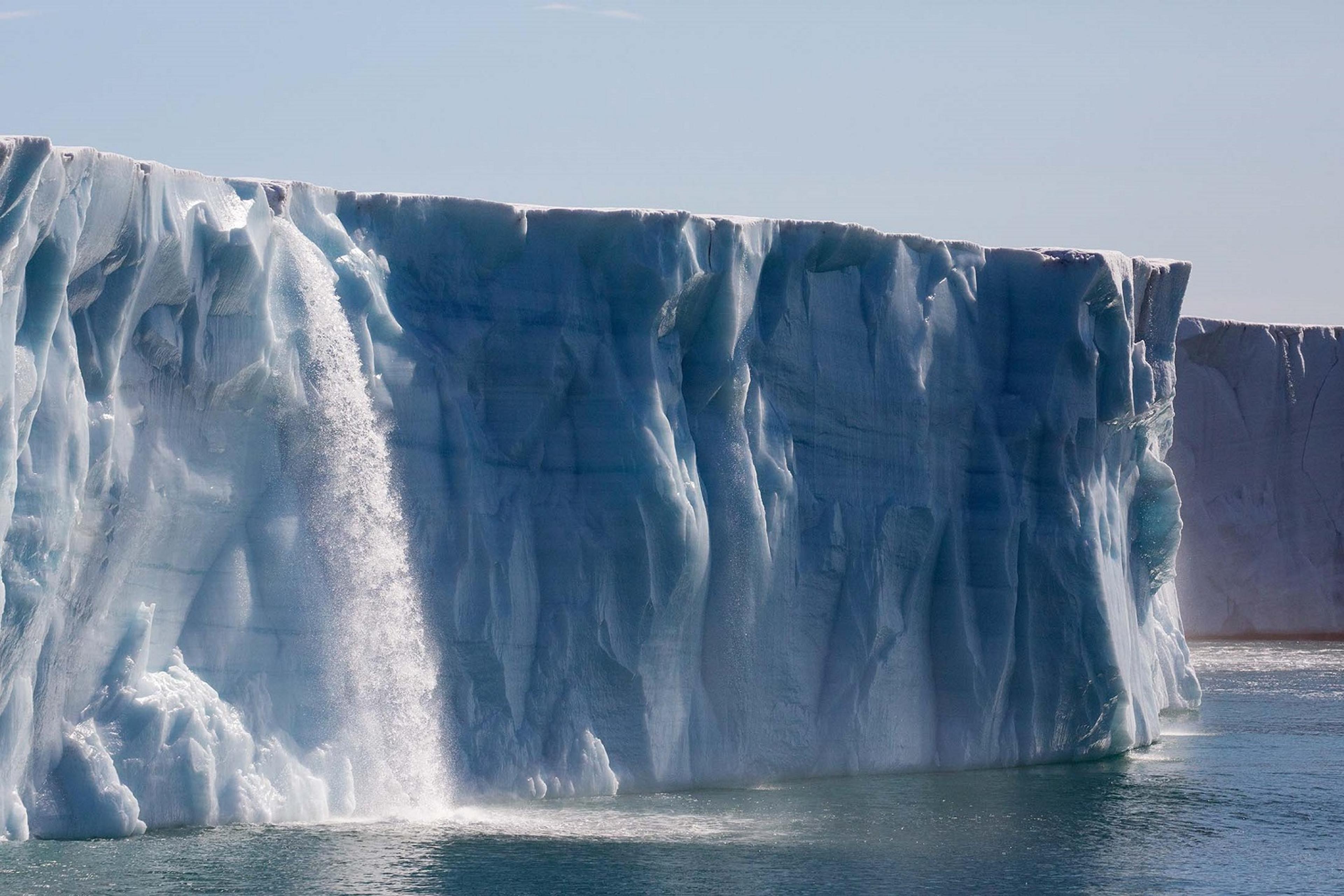 Glacial runoff gushes into the sea from atop the Brasvellbreen Glacier, Svalbard/Denis Elterman