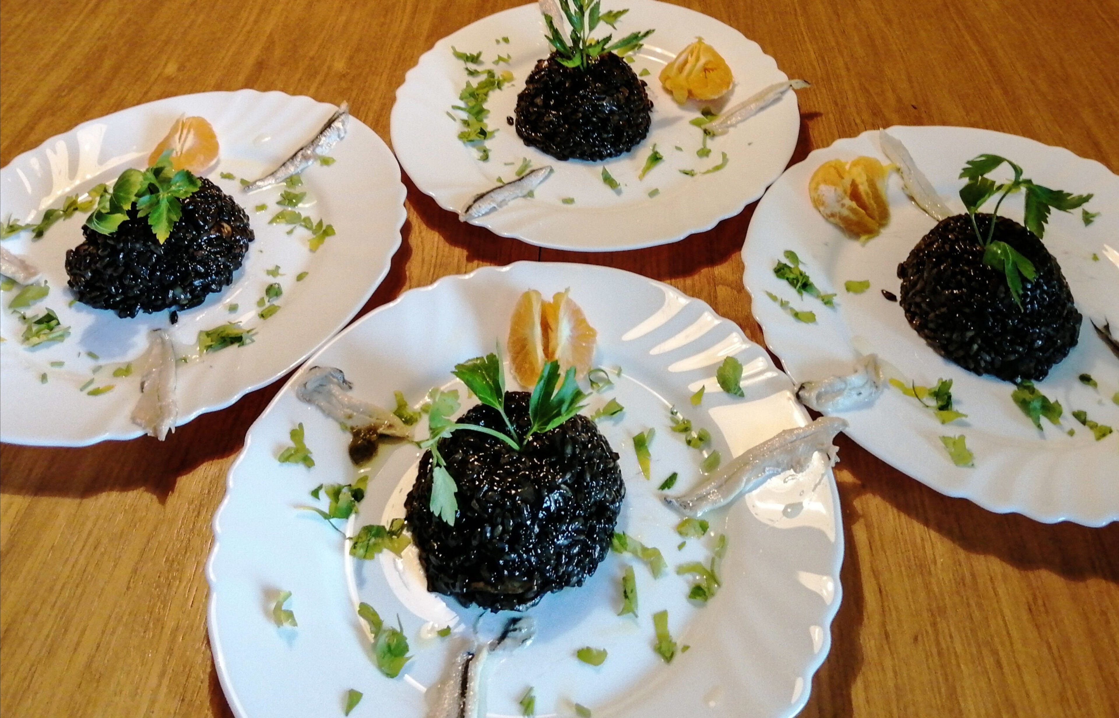 Black risotto with cuttlefish and tangerine in Croatia/Getty Images
