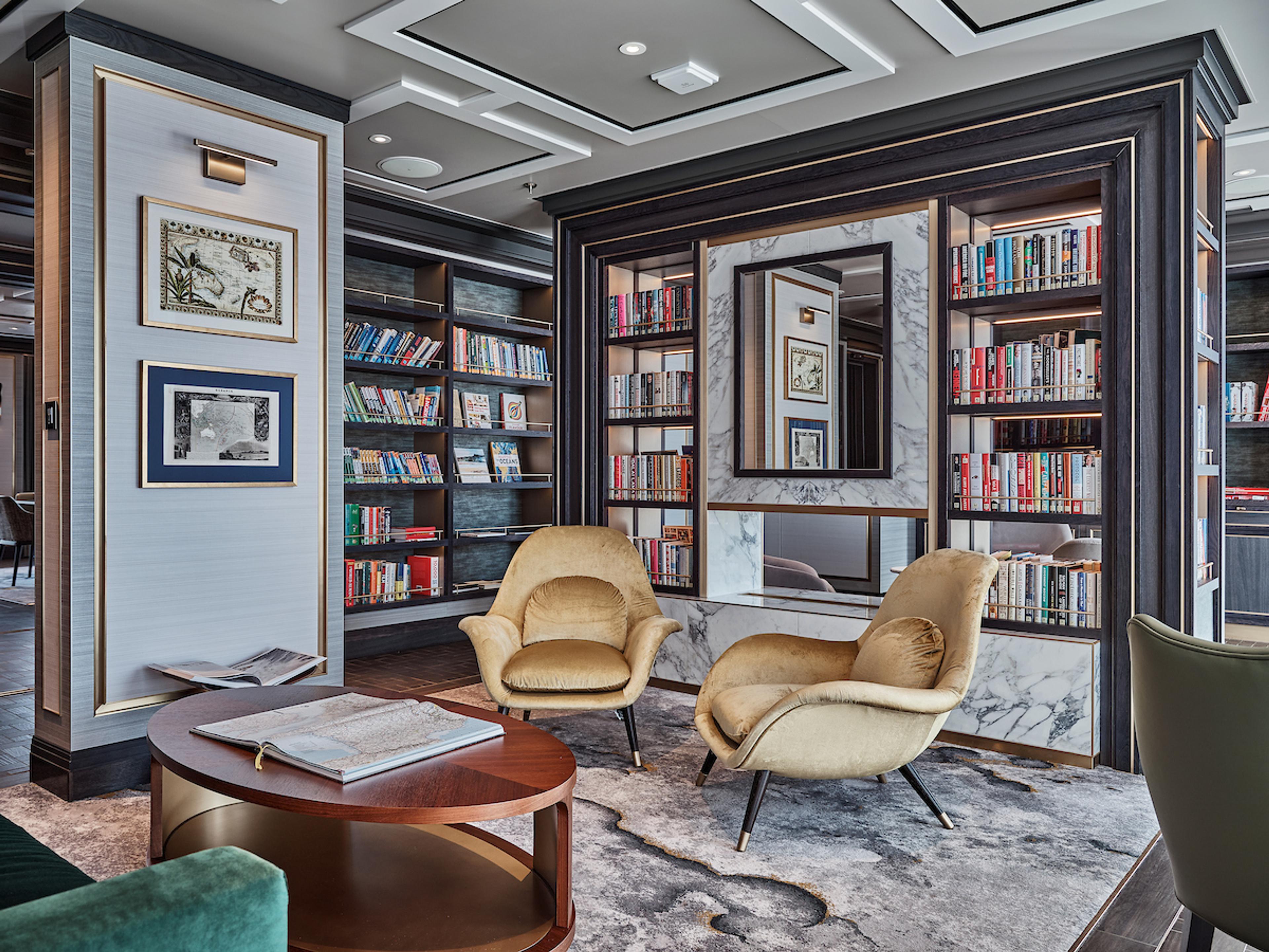 The library on the Silver Endeavour offers plenty of reading material for guests./Silversea