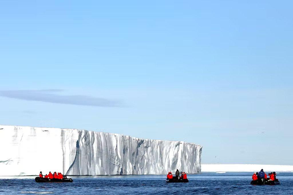 That chill in the air? It encourages couples to get closer on a Zodiac outing like this one in Svalbard in the Arctic./Silversea