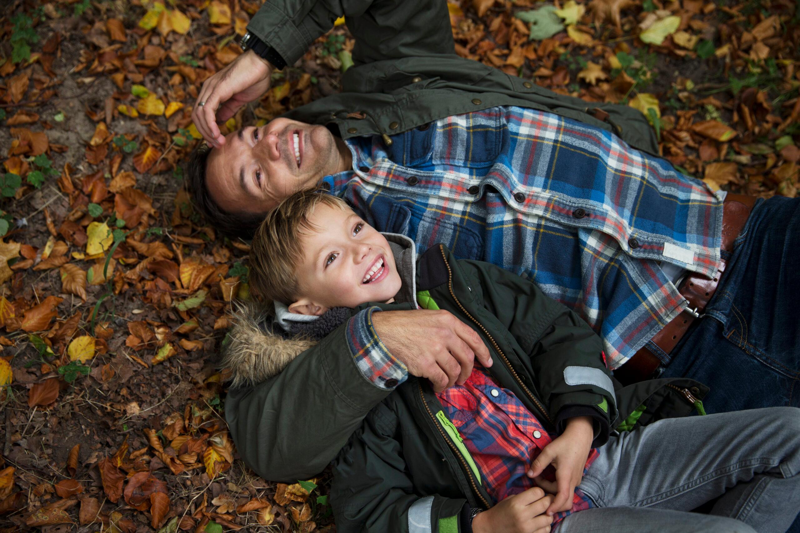 Hygge need not be elaborate. It can be as simple as dad and son, in Maribo, Denmark, enjoying the fall colors./Getty Images
