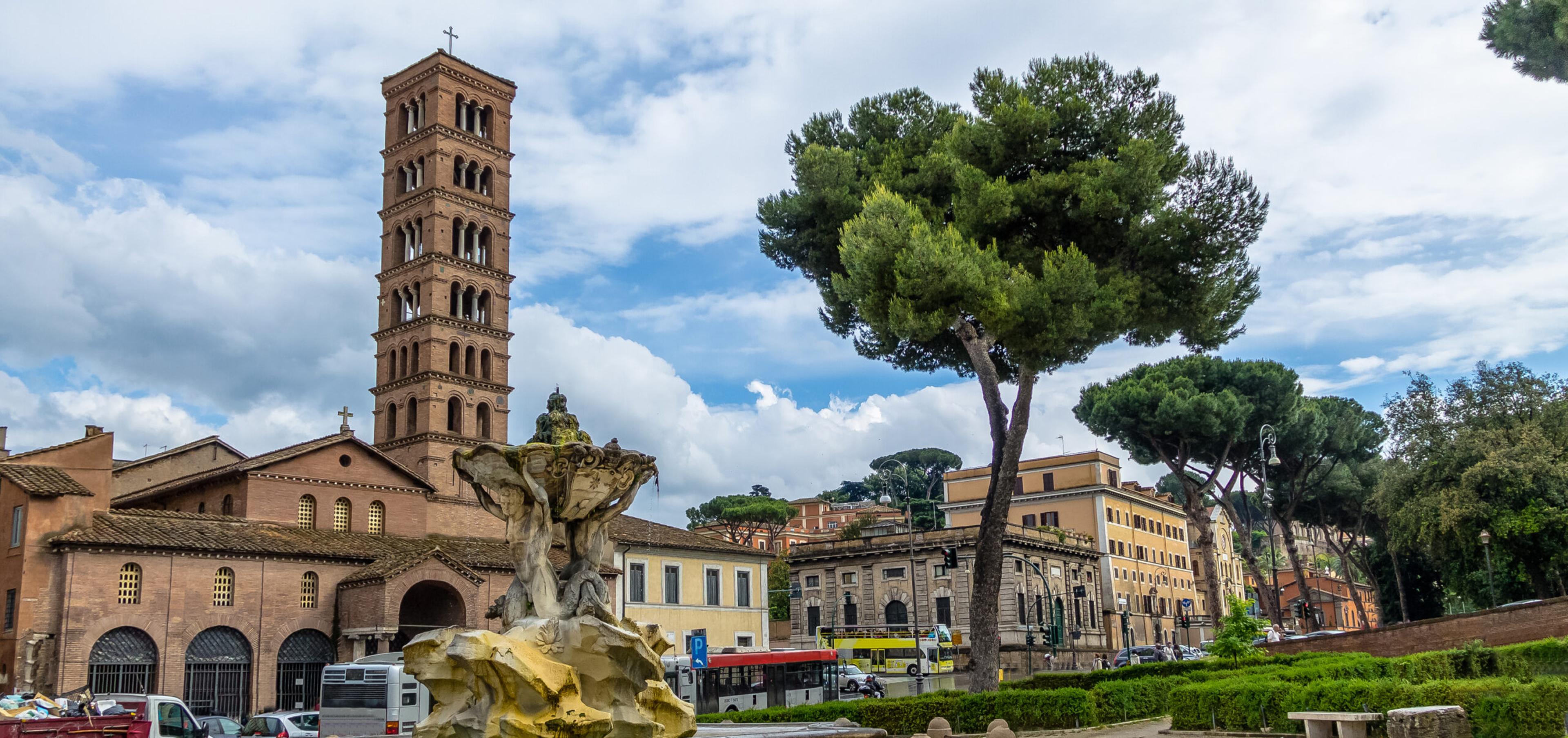 Tritons fountain and Basilica of Saint Mary in Cosmedin (Santa Maria in Cosmedin) at Piazza Bocca della Verita (Mouth of the Truth) - Rome, Italy