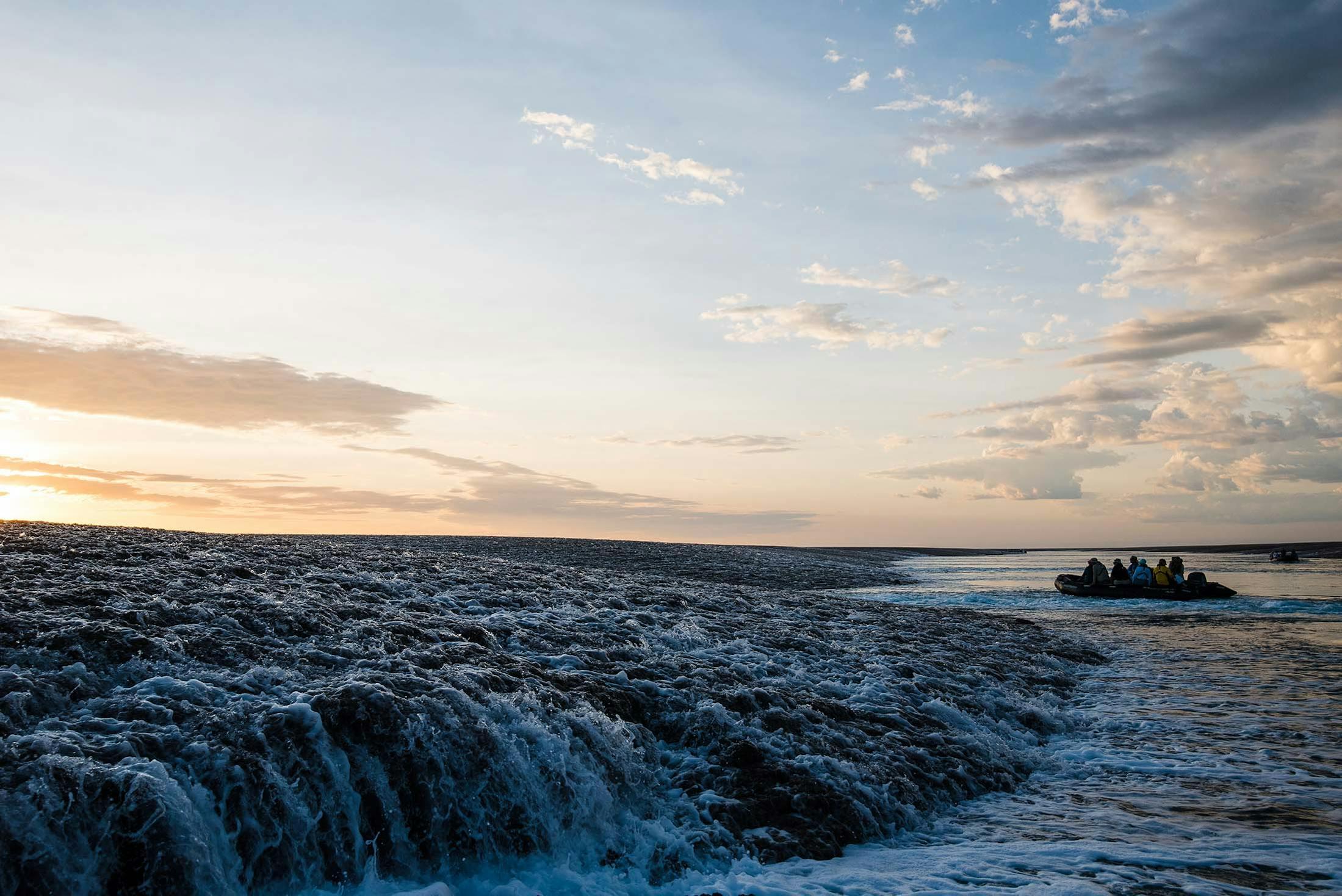 A Zodiac approaches the Montgomery Reef, Kimberley, Australia./Denis Elterman