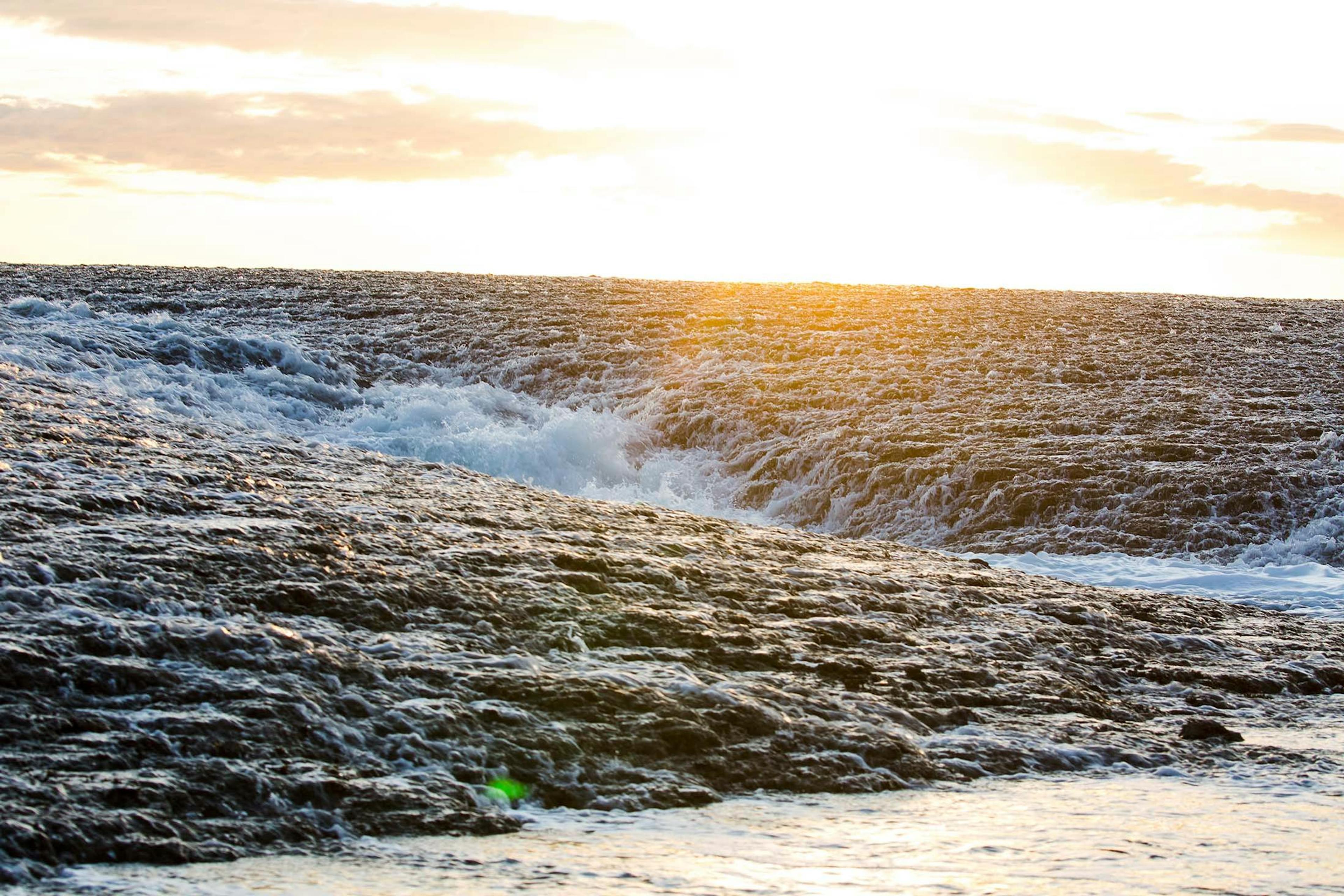 The sun shines on the Montgomery Reef./Denis Elterman