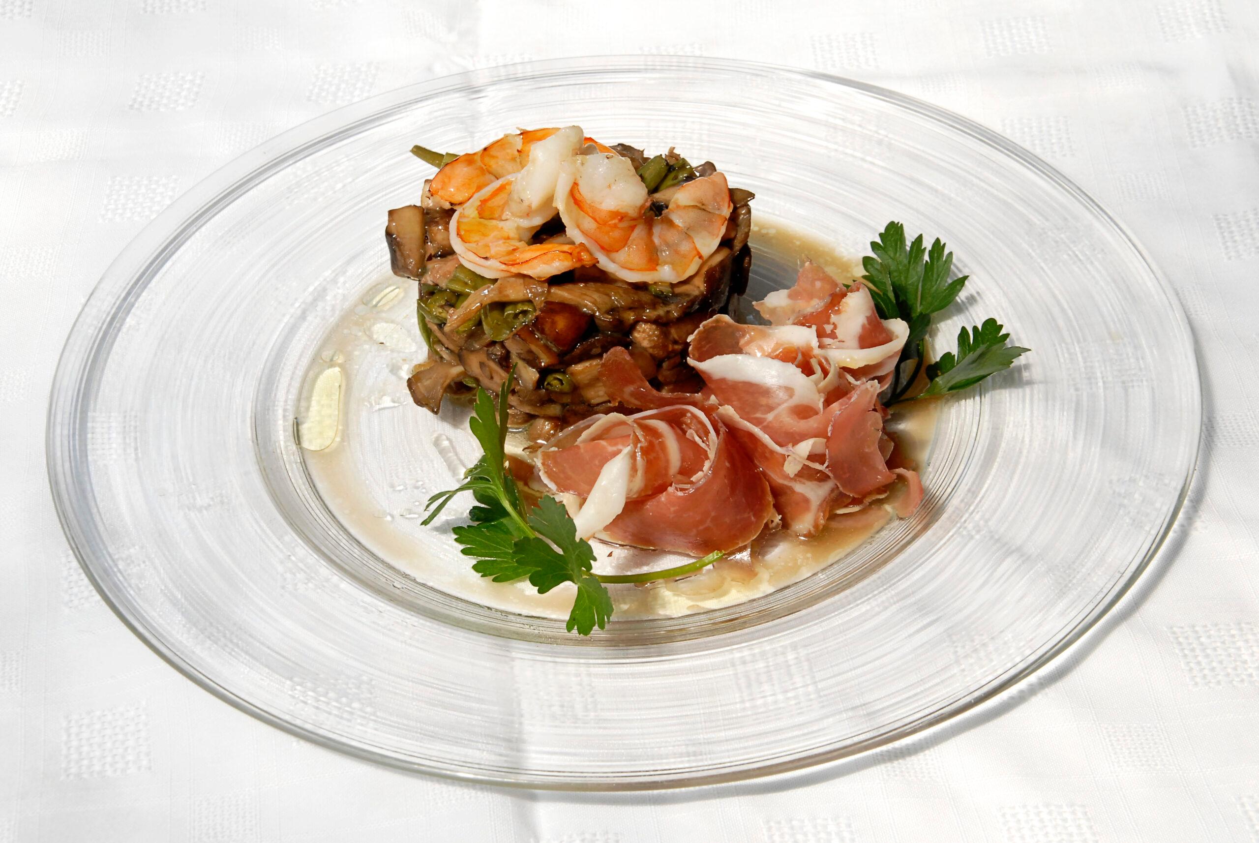 Spain's Iberico ham, serrano ham dish with pork and shrimp./Getty Images