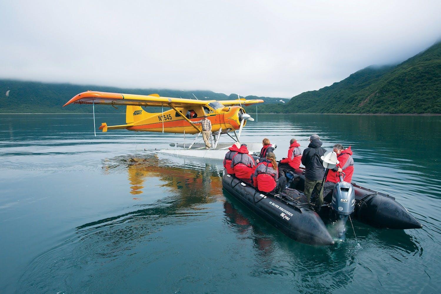 Silversea's guests approach a floatplane by Zodiac in Geographic Harbor in the Katmai National Park, Alaska/Richard Sidey