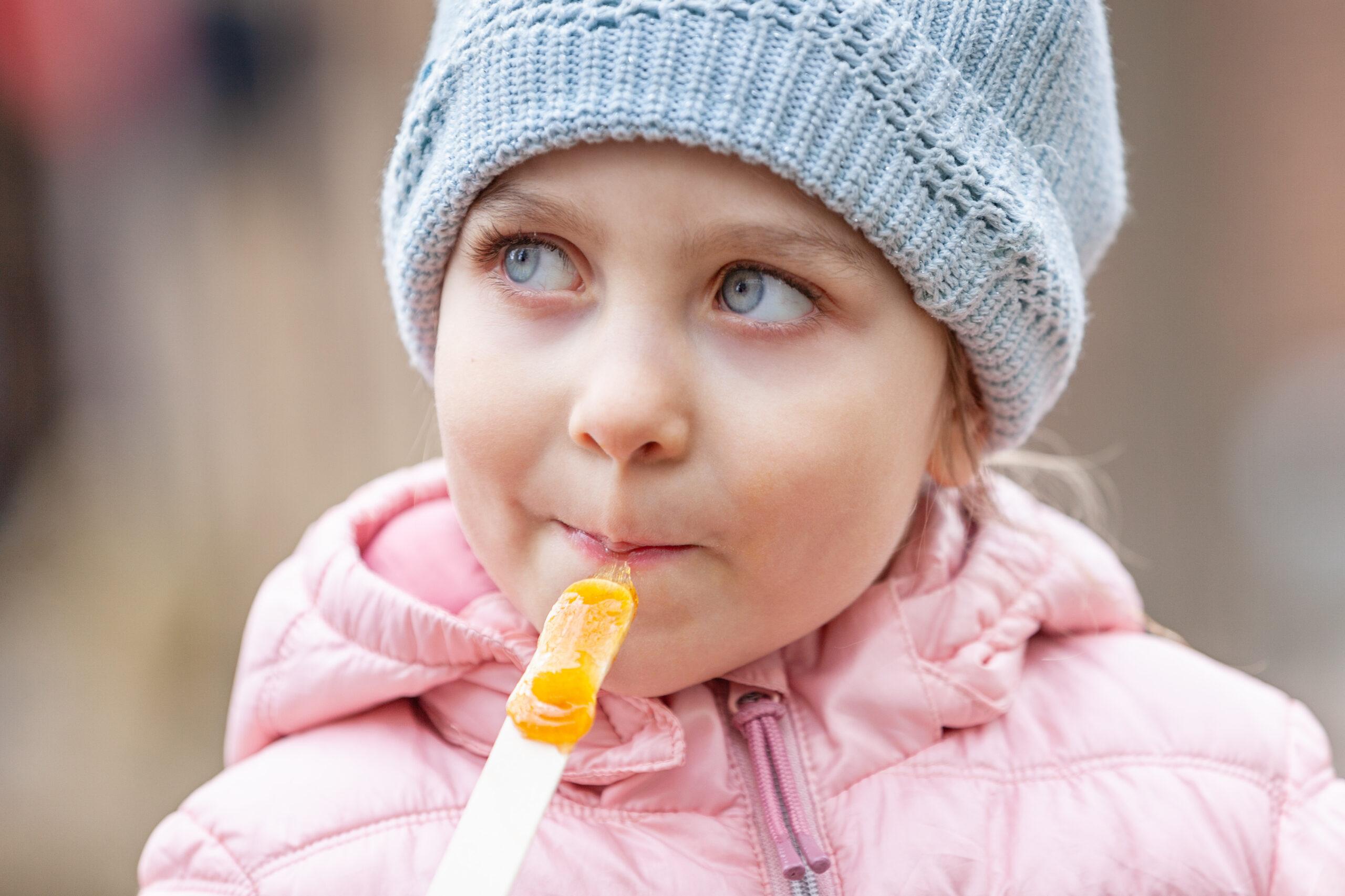 Enjoying sugar-maple taffy at a sugar shack in Quebec./Shutterstock