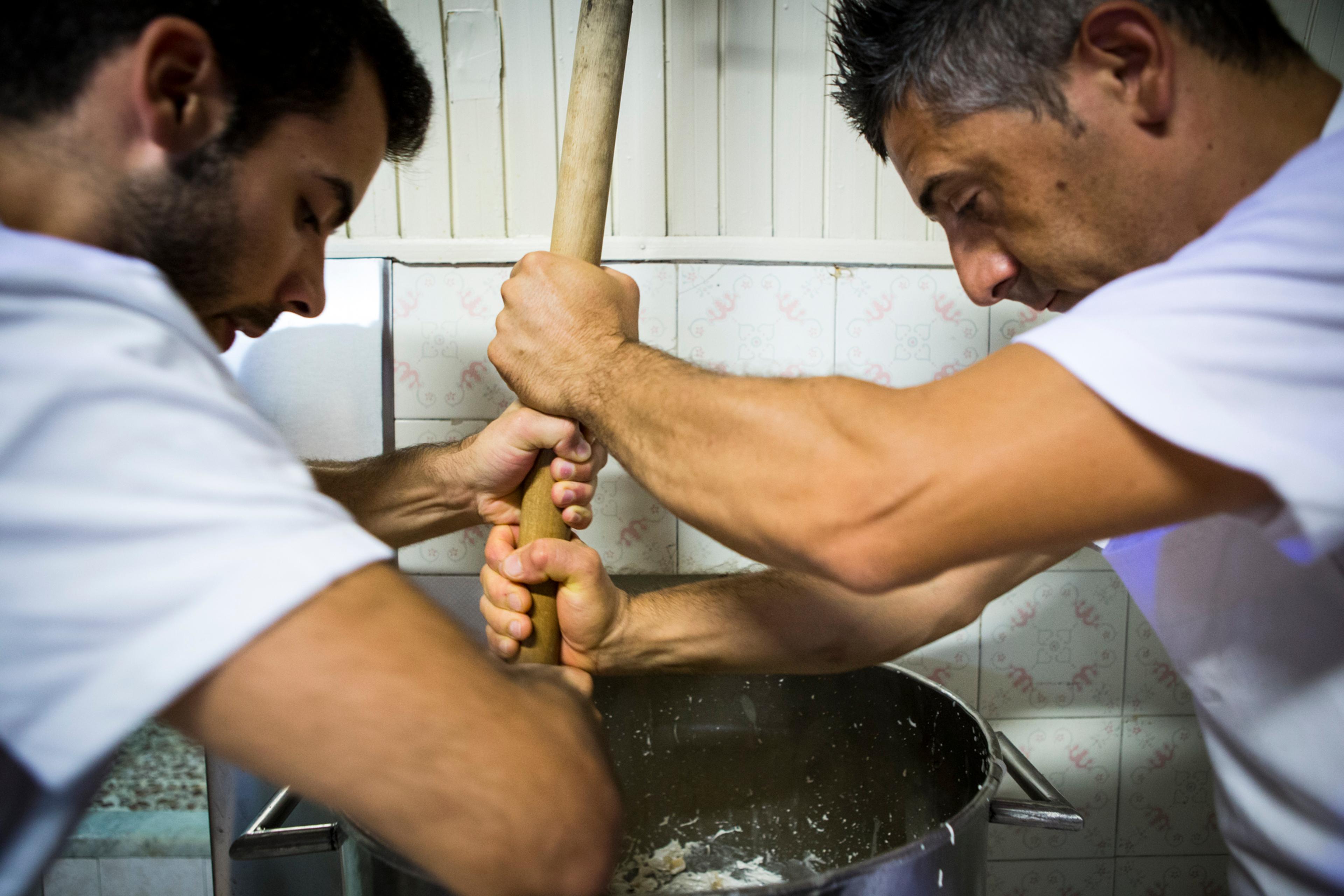 Corrado Assenza's son, Francesco (left), prepares Caffè Sicilia's almond nougat with Corrado Lucci, Corrado Assenza's right-hand man of 36 years/Giuseppe Portuesi
