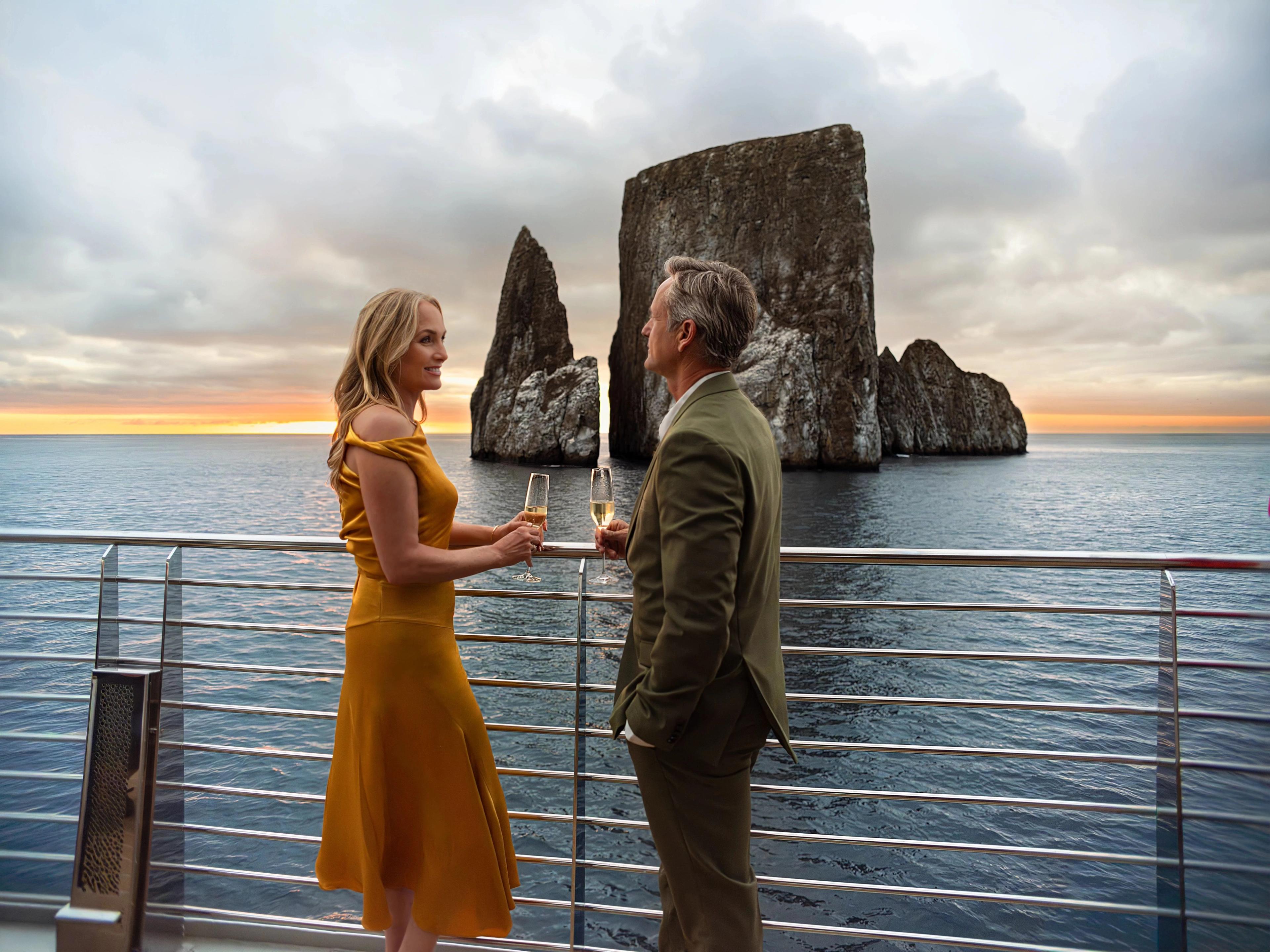 Sunset drinks in the Galapagos, guests enjoy a quieter atmosphere on board.