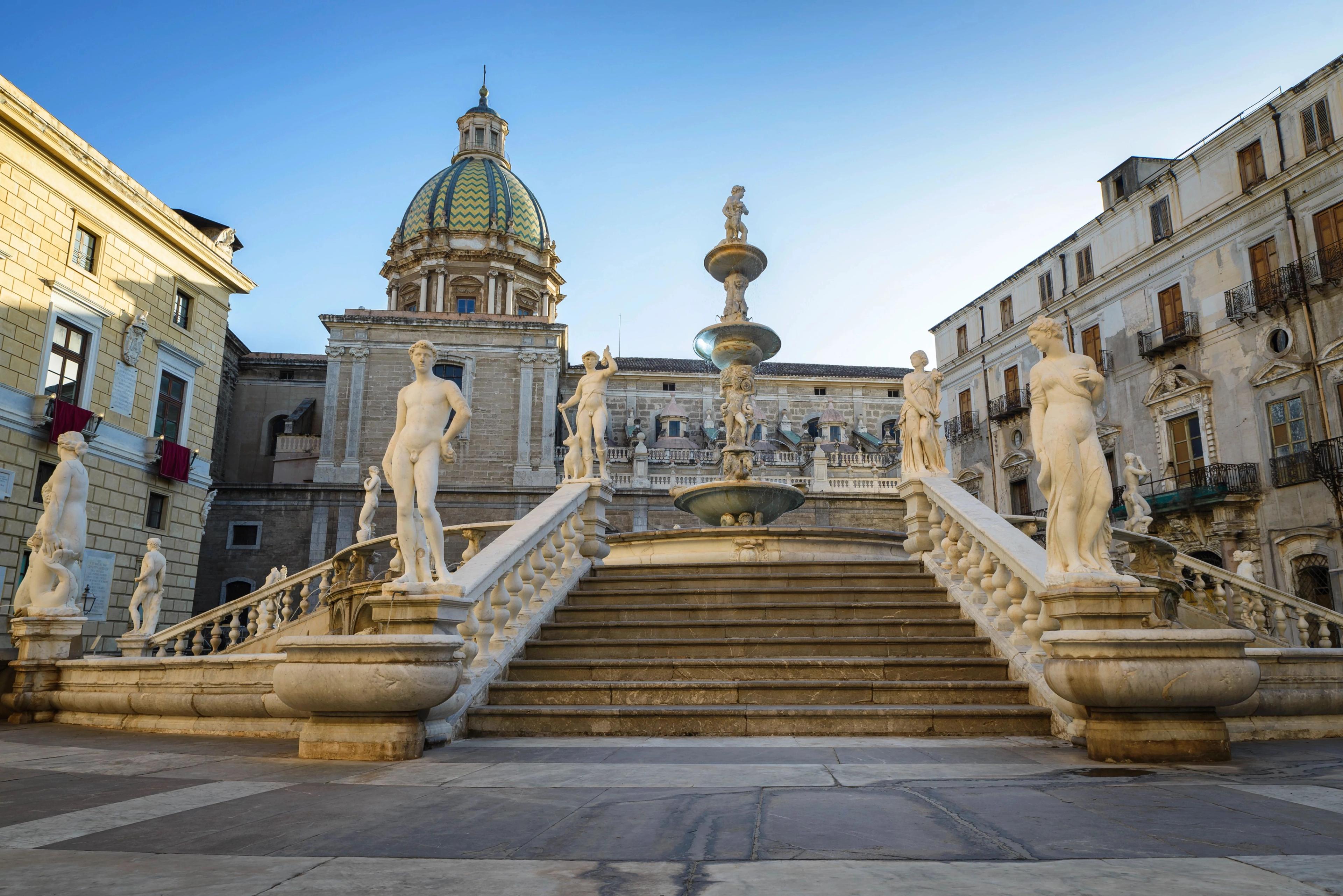 Historic stone cathedral architecture showcasing majestic towering domes framing blue skies.