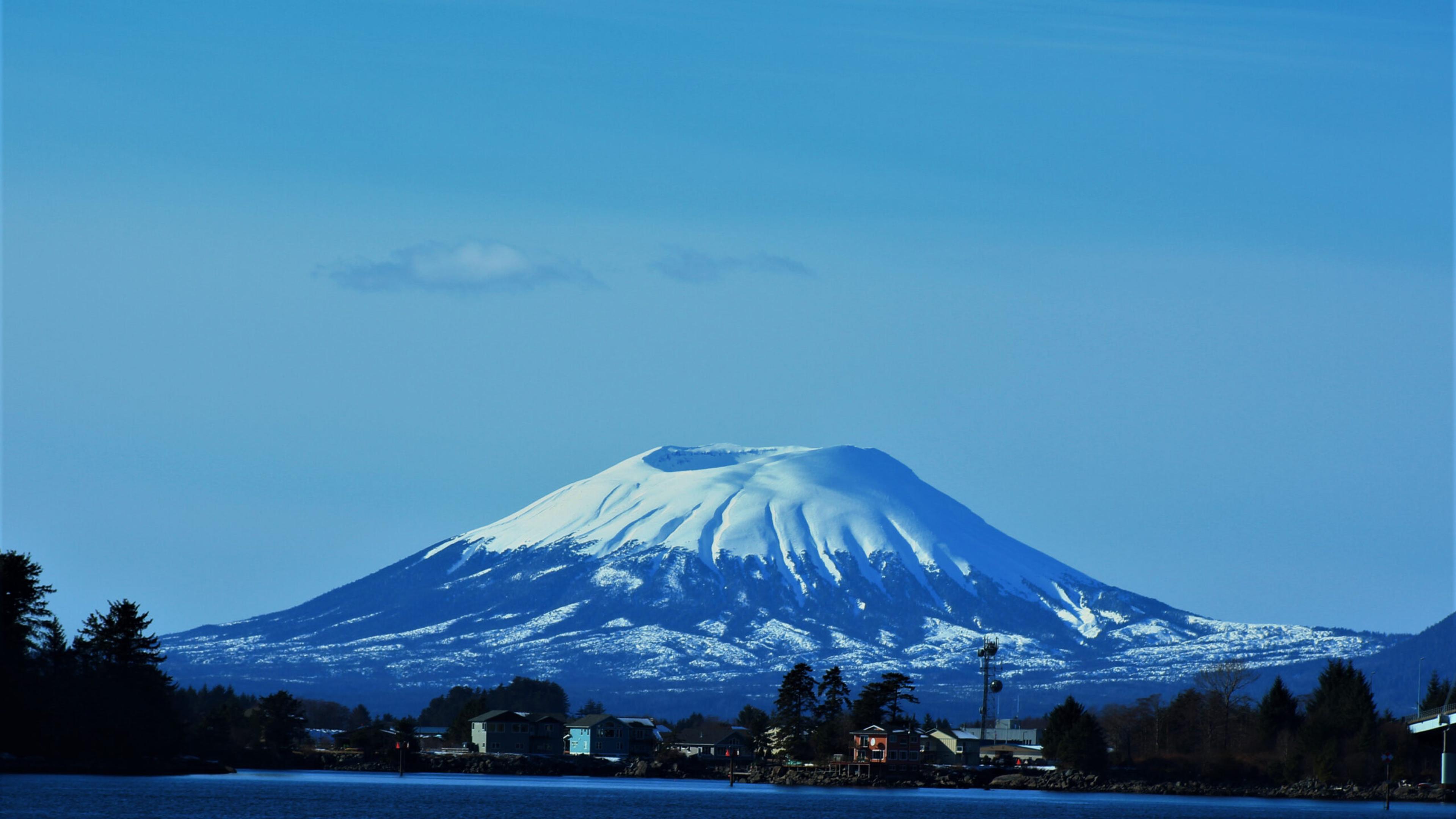 Mt. Edgecumbe seems to float on the horizon of Sitka./Shutterstock