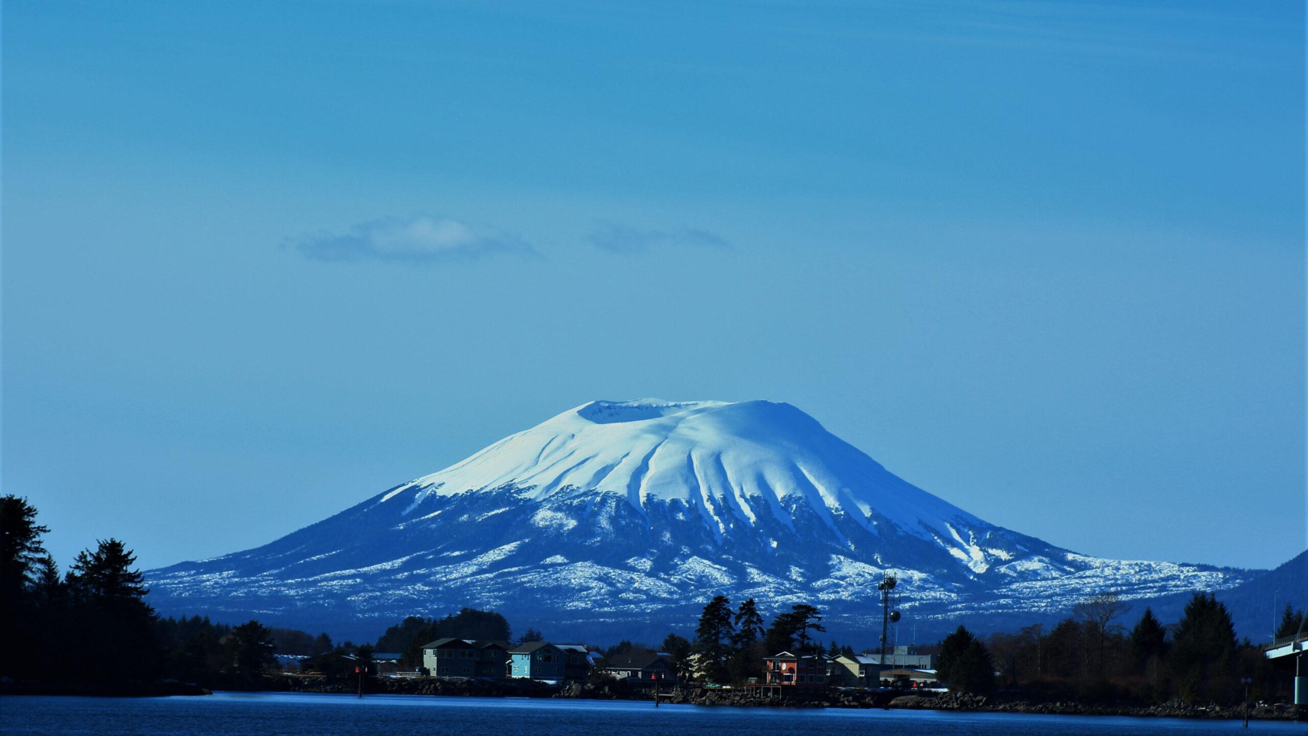 Mt. Edgecumbe seems to float on the horizon of Sitka./Shutterstock