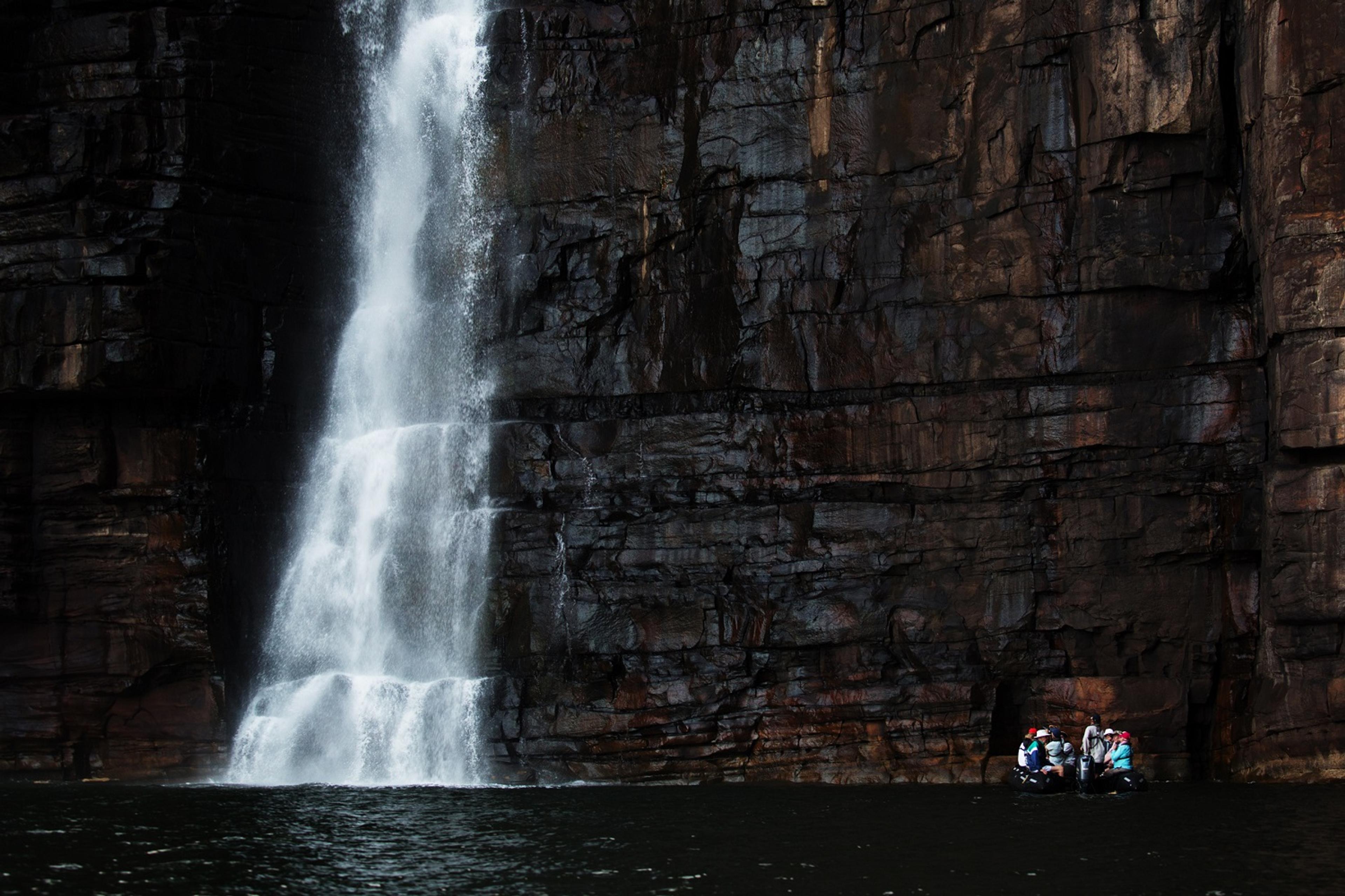 A Zodiac against the huge wall of water./Denis Elterman