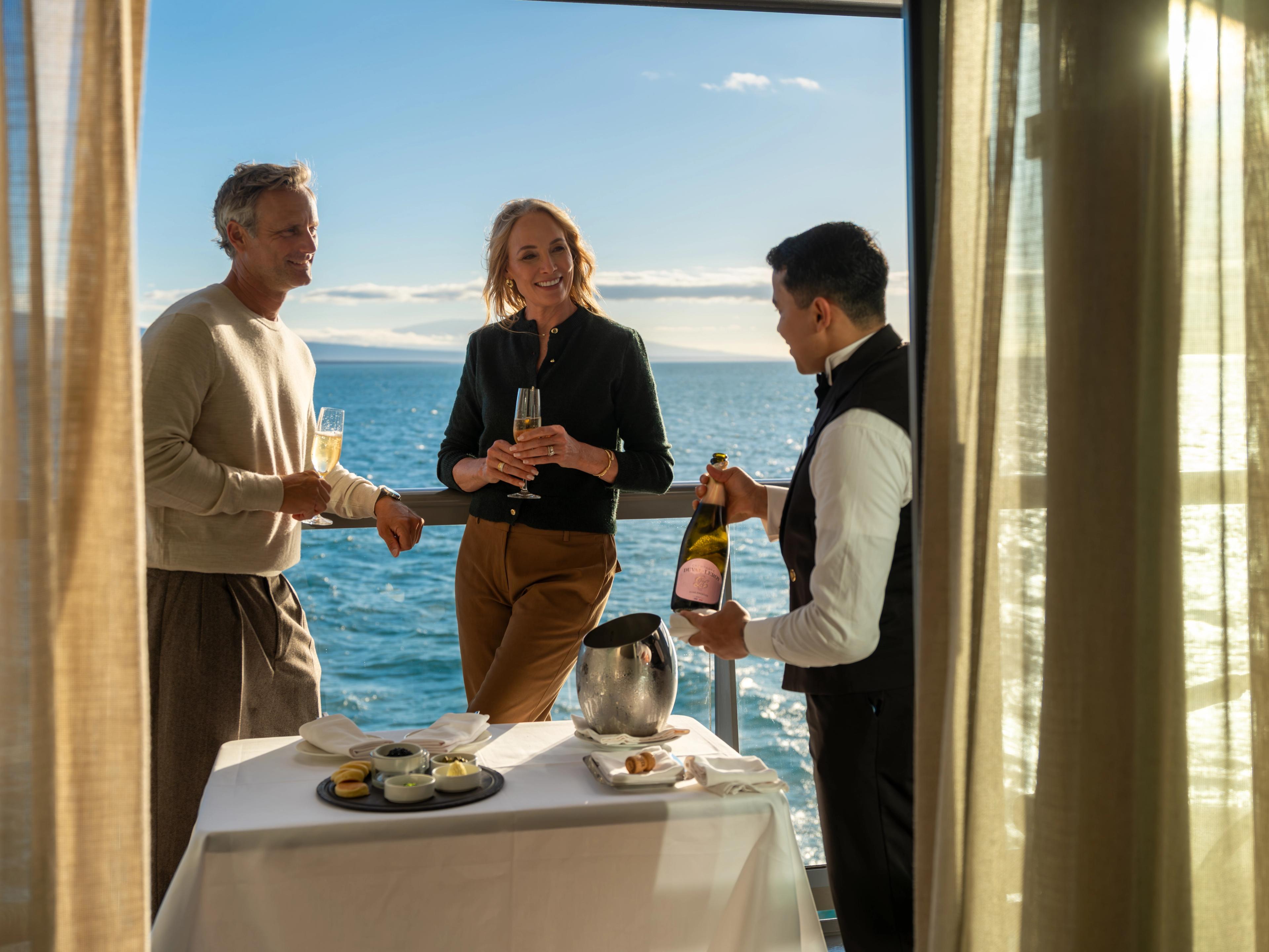 Unwinding with breathtaking ocean views and personalized champagne service right on the deck.