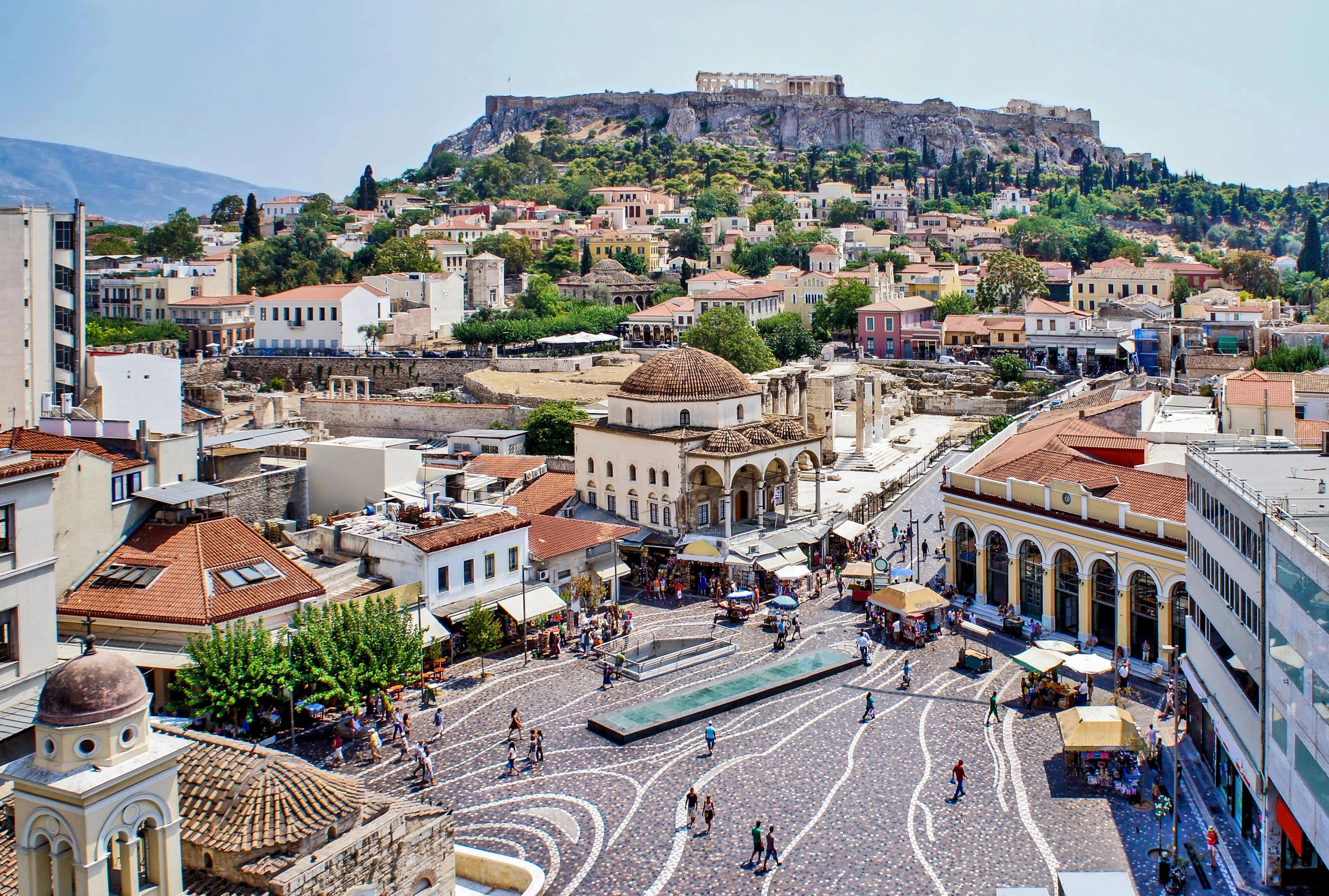 Monastiraki Square in Athens, Greece, with the Acropolis rising in the background.