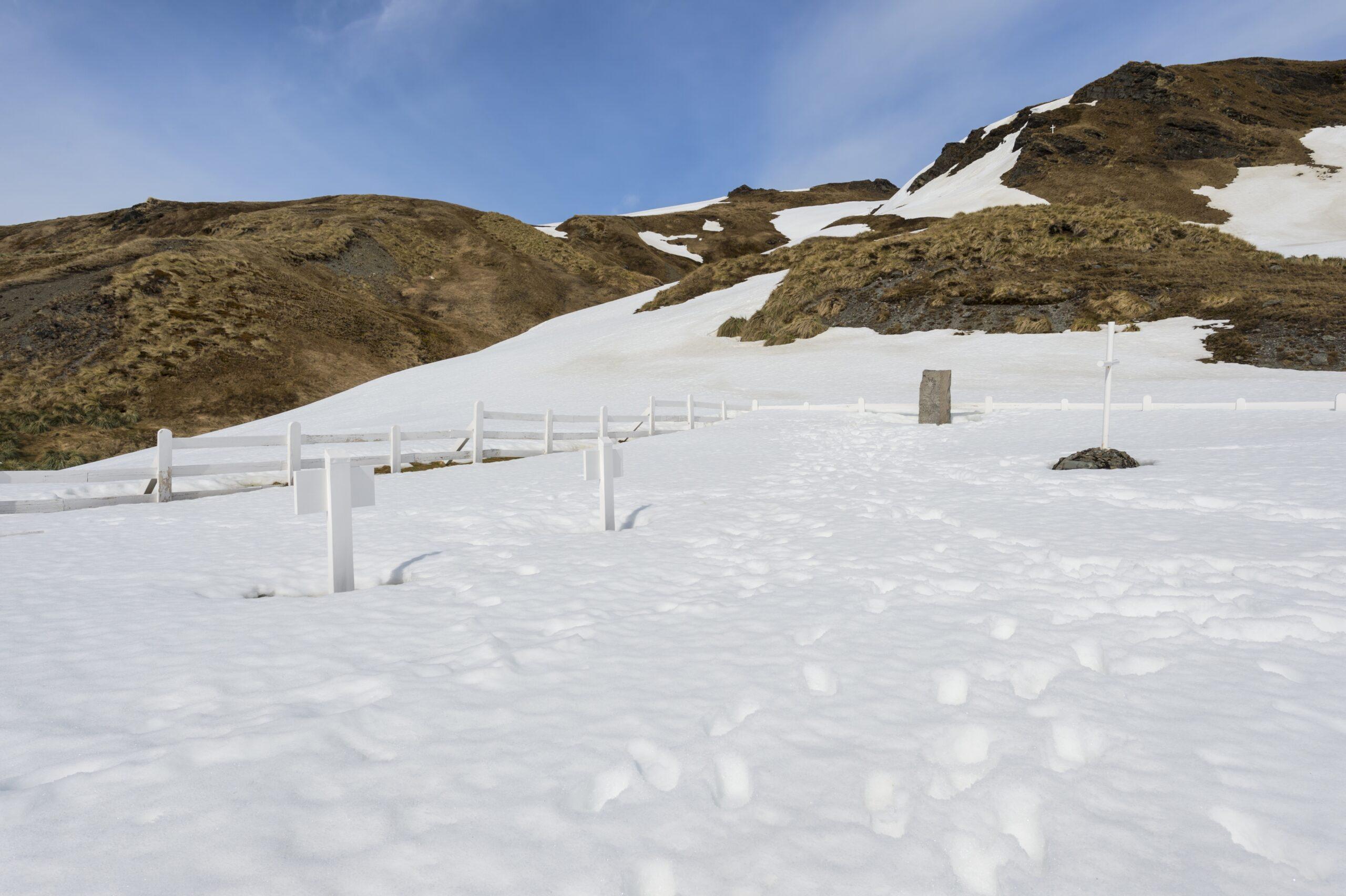 Grytviken cemetery with Ernest Shackleton's grave under snow, King Edward Cove, South Georgia. /Shutterstock