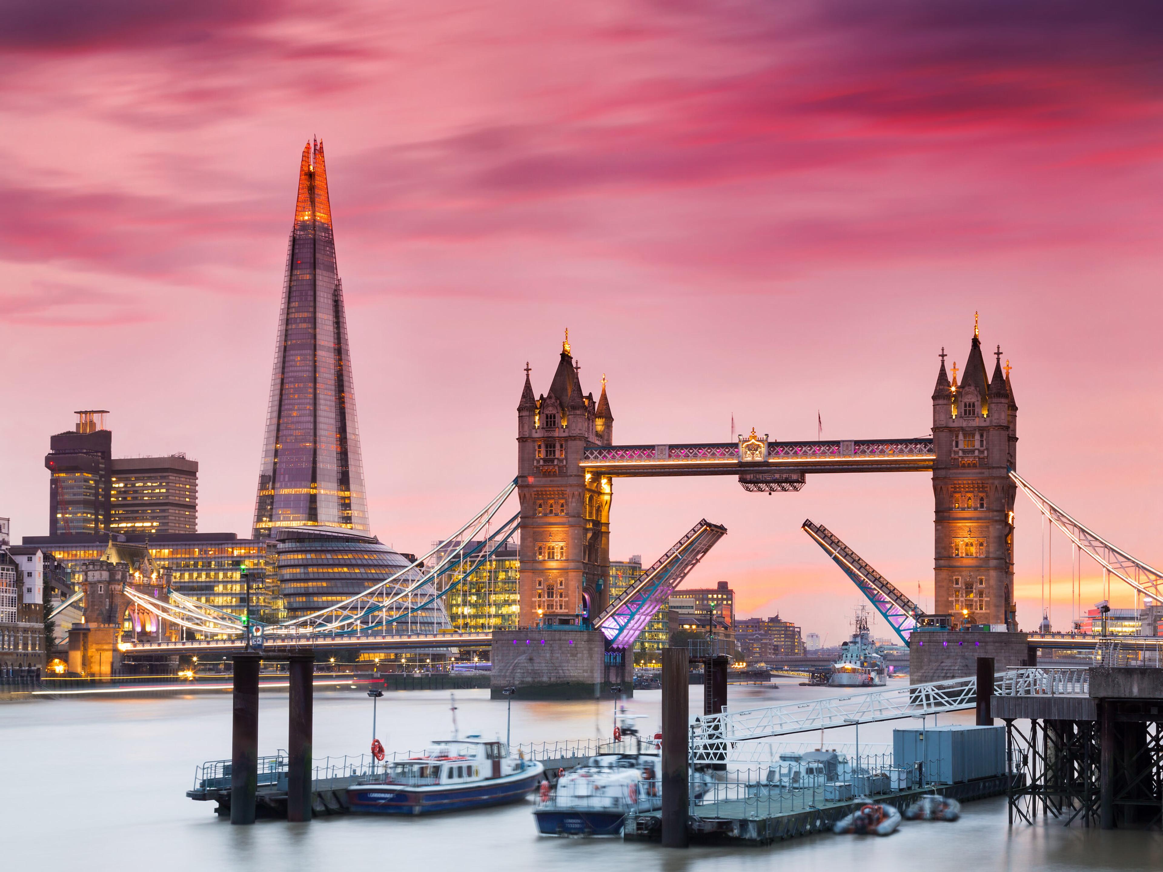 Tower Bridge is a bascule bridge that opens for taller-masted vessels and closes again./Shutterstock